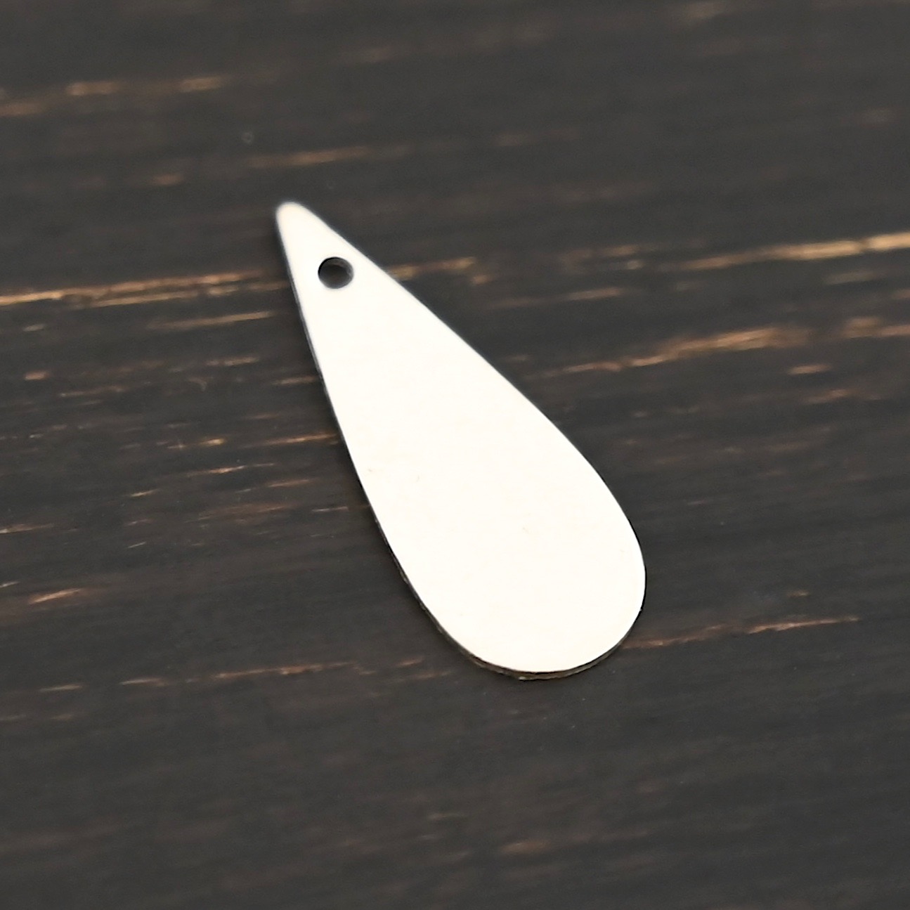 Sterling Silver Teardrop Blank - shiny smooth shown on dark background