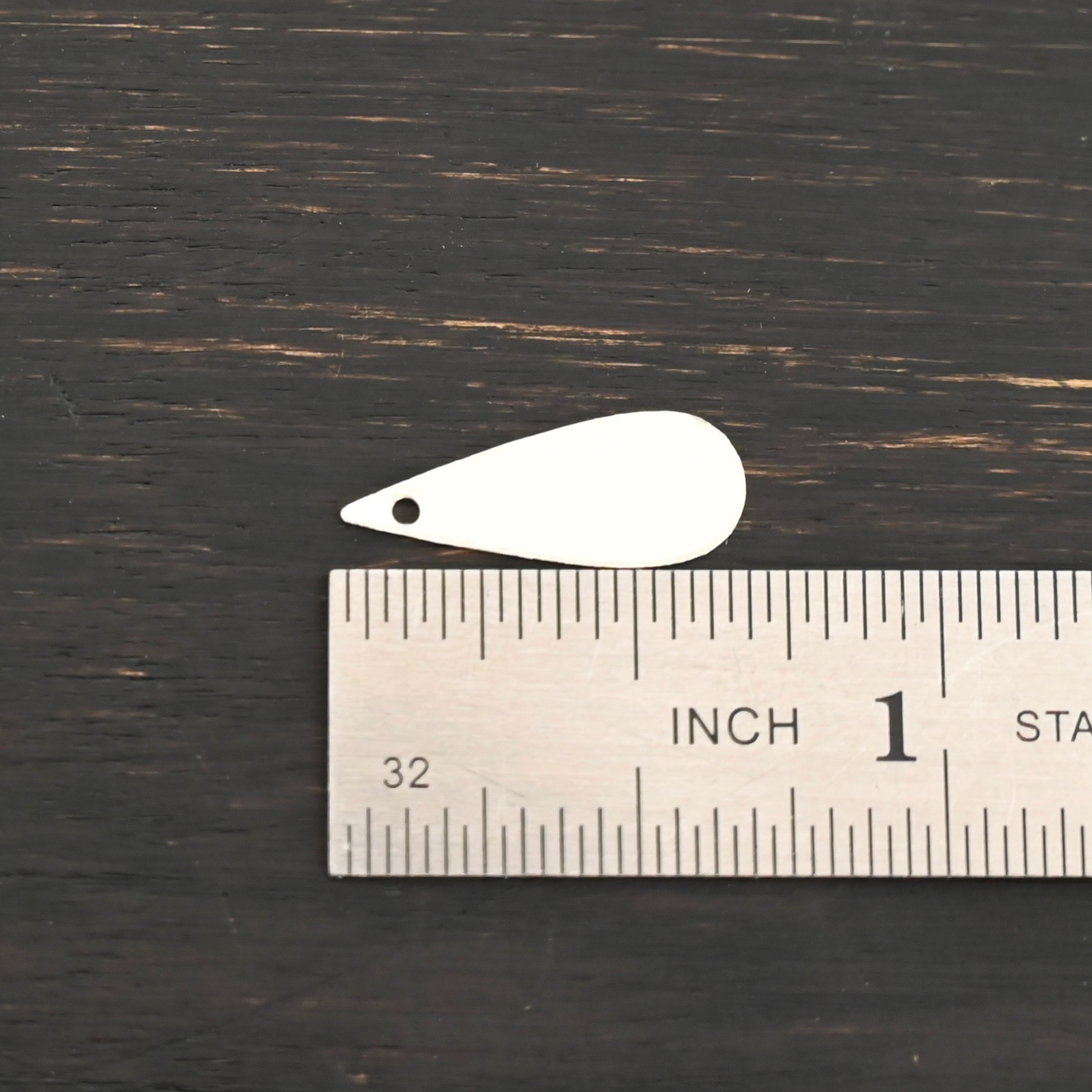 Sterling Silver Teardrop Blank - shiny smooth shown by ruler