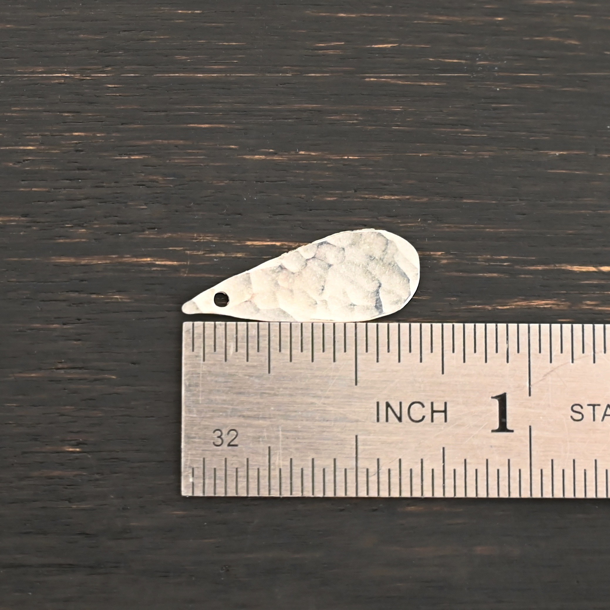 Sterling Silver Teardrop Blank - shiny hammered shown by ruler