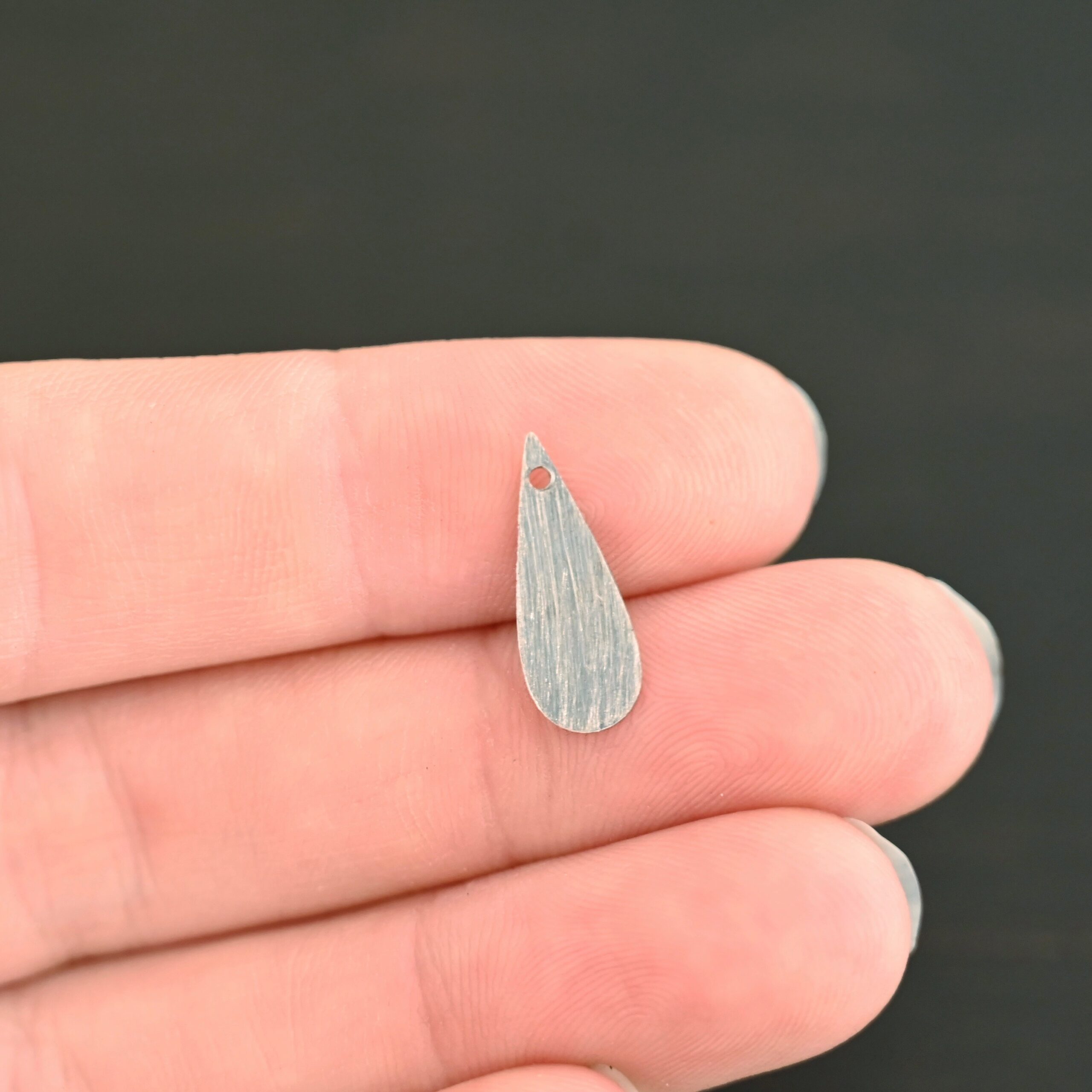 Sterling Silver Teardrop Blank - oxidized smooth shown in hand