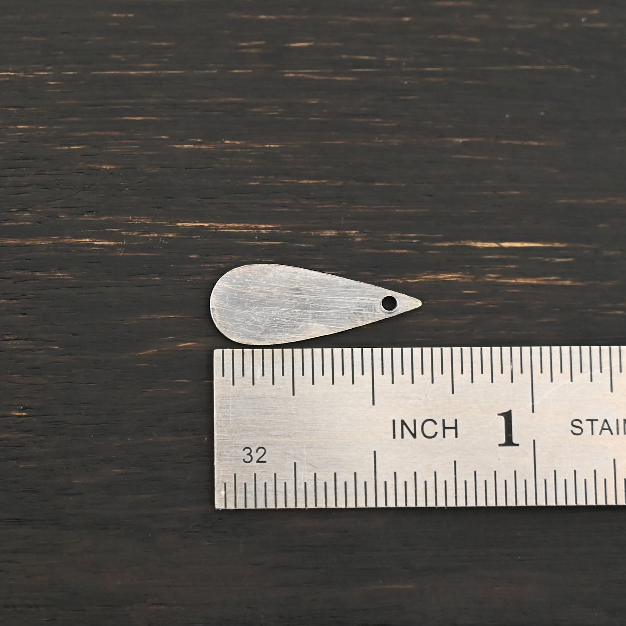Sterling Silver Teardrop Blank - oxidized smooth shown by ruler