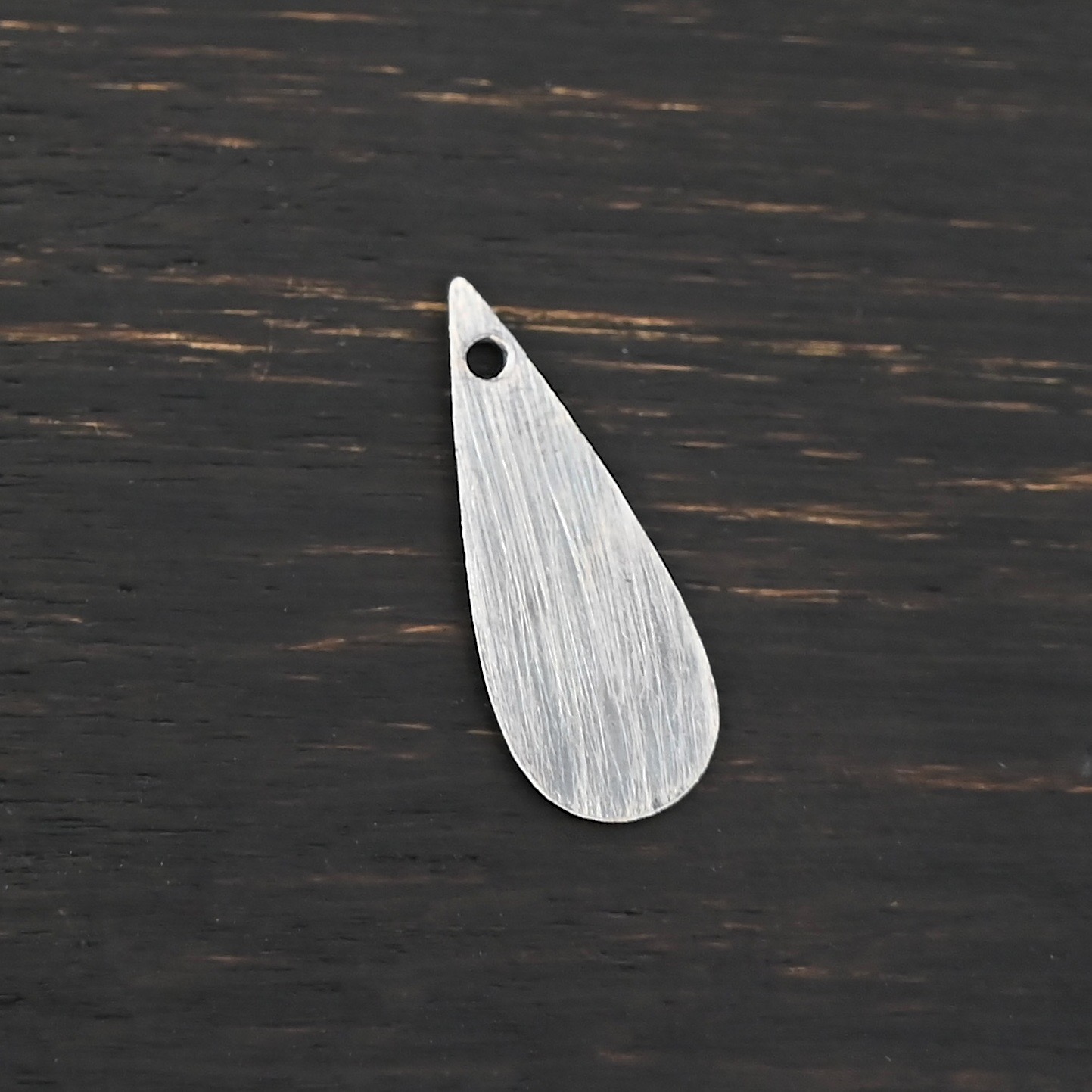 Sterling Silver Teardrop Blank - oxidized smooth shown on dark background