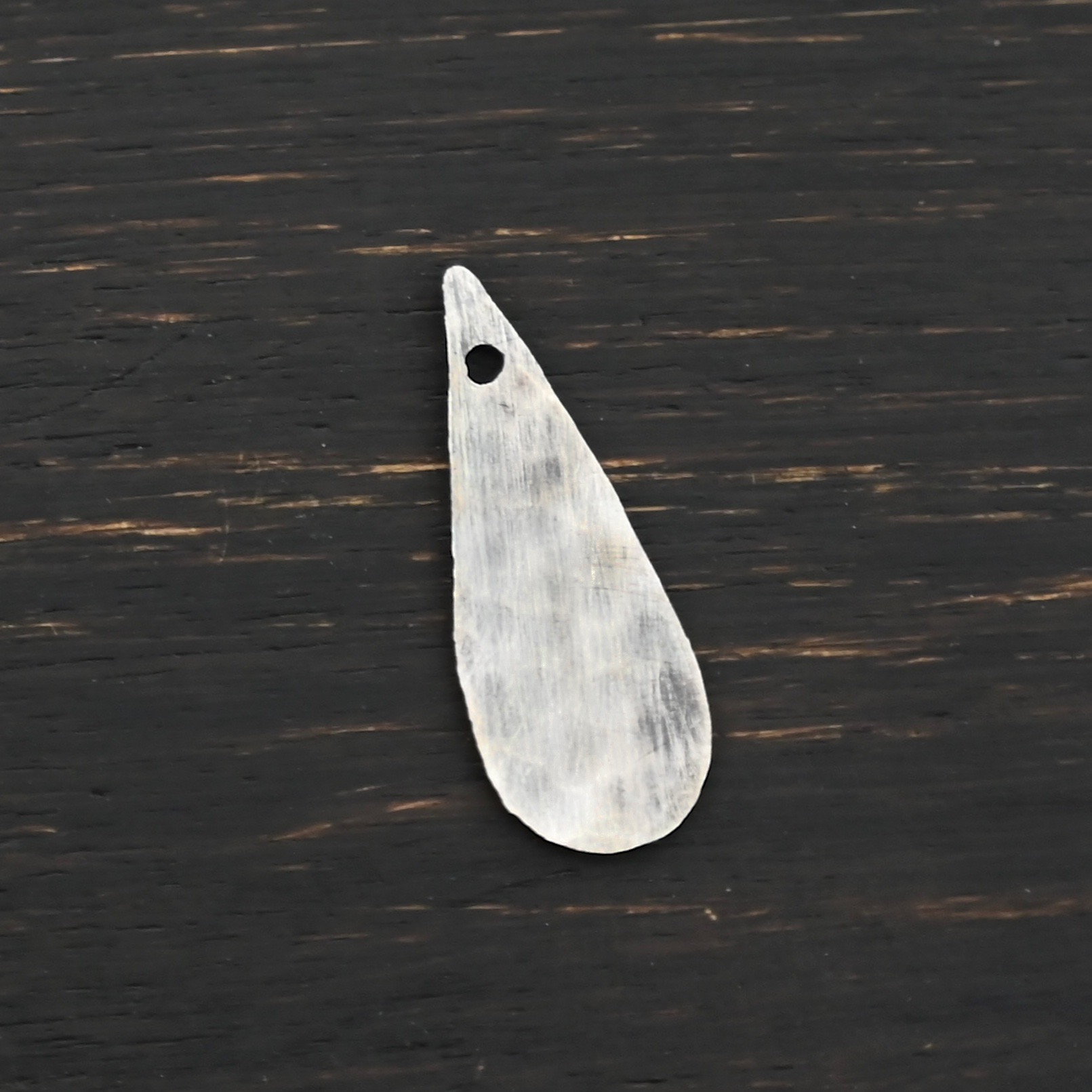 Sterling Silver Teardrop Blank - oxidized hammered shown on dark background