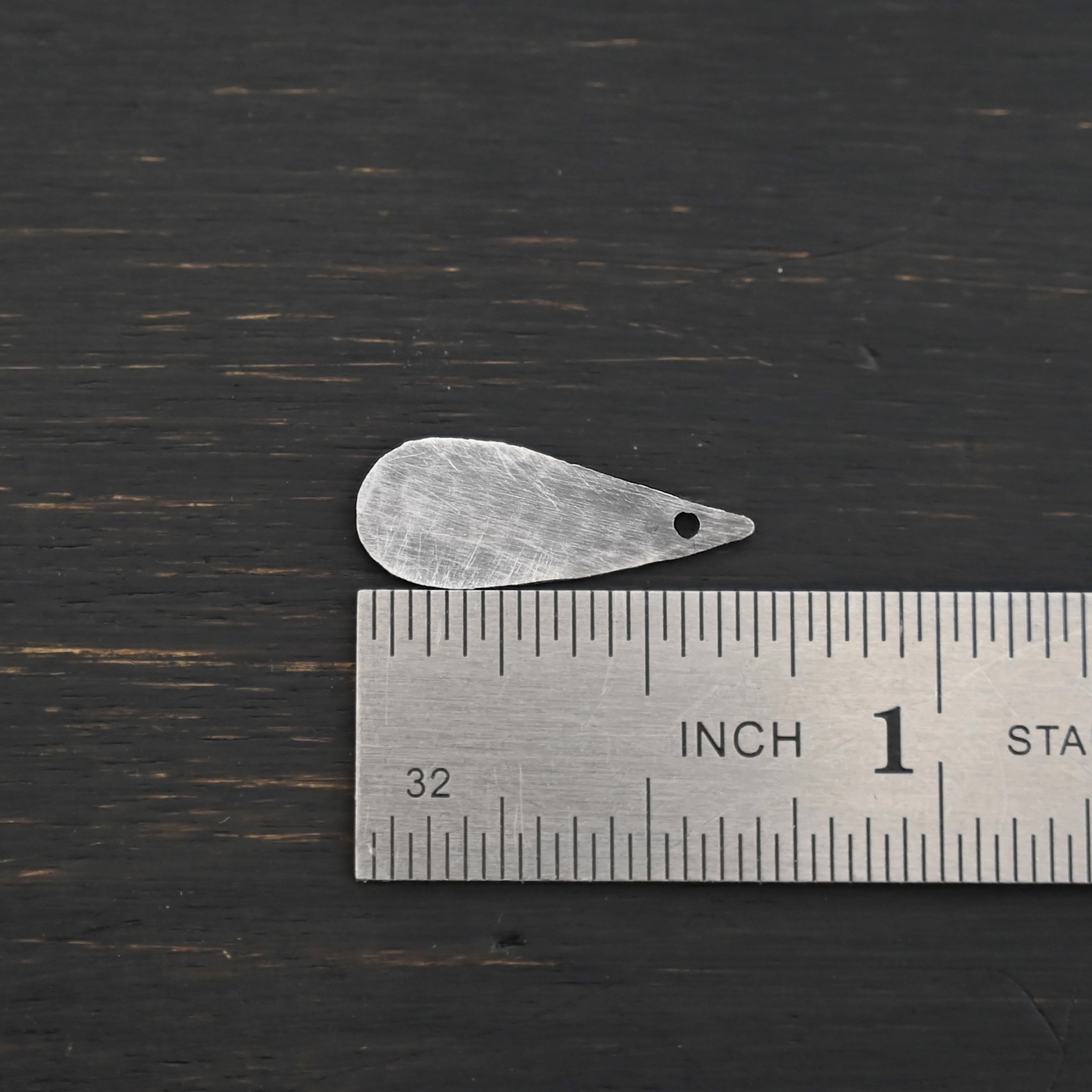 Sterling Silver Teardrop Blank - oxidized hammered shown by ruler