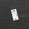 Sterling Silver small rectangle blank - shiny hammered 2 holes shown on dark background