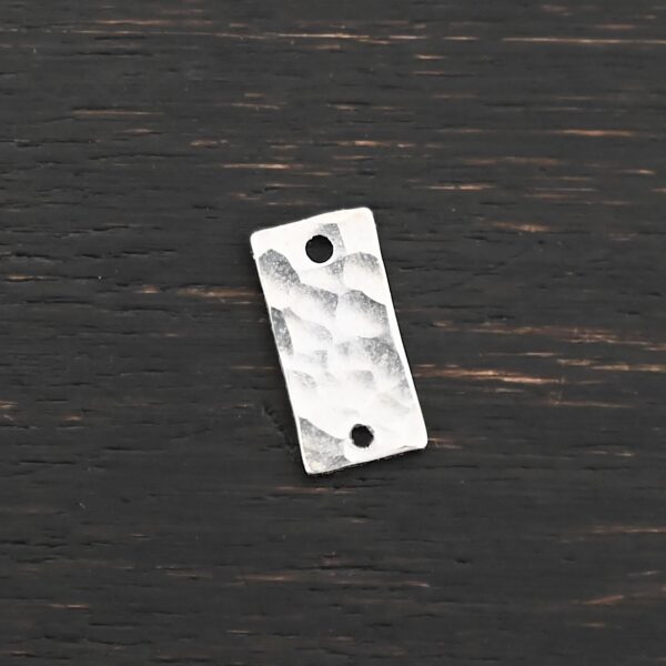 Sterling Silver small rectangle blank - shiny hammered 2 holes shown on dark background