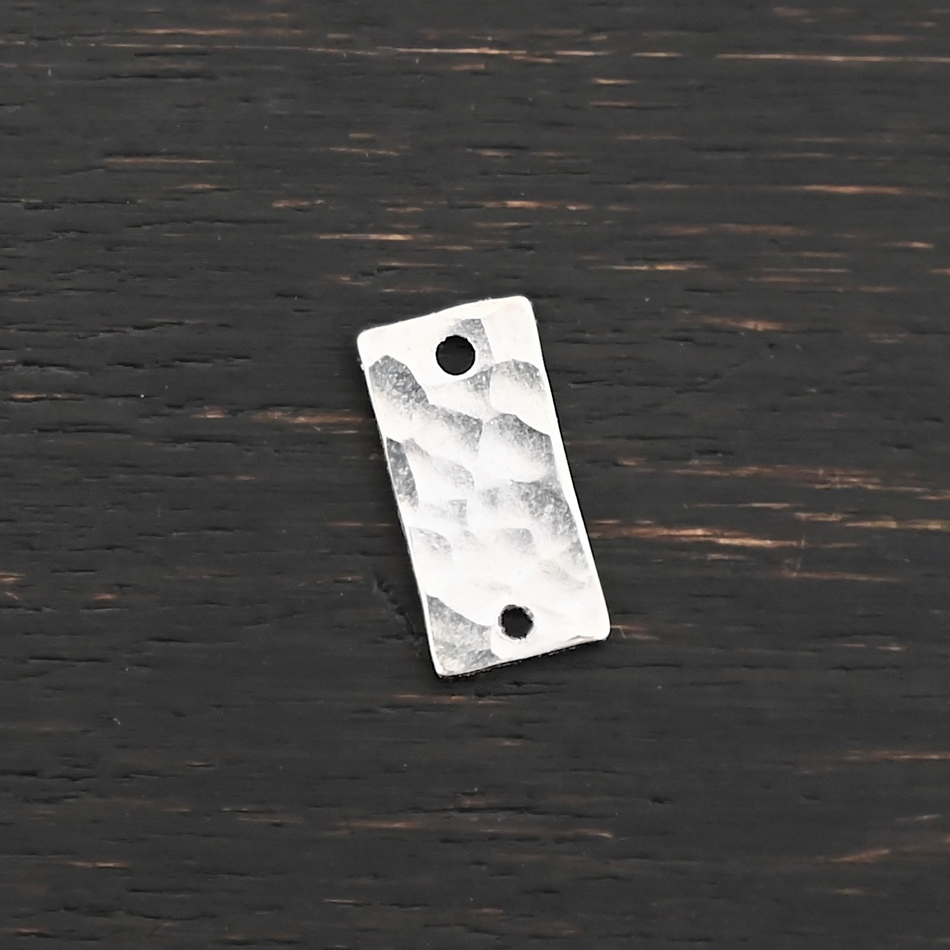 Sterling Silver small rectangle blank - shiny hammered 2 holes shown on dark background