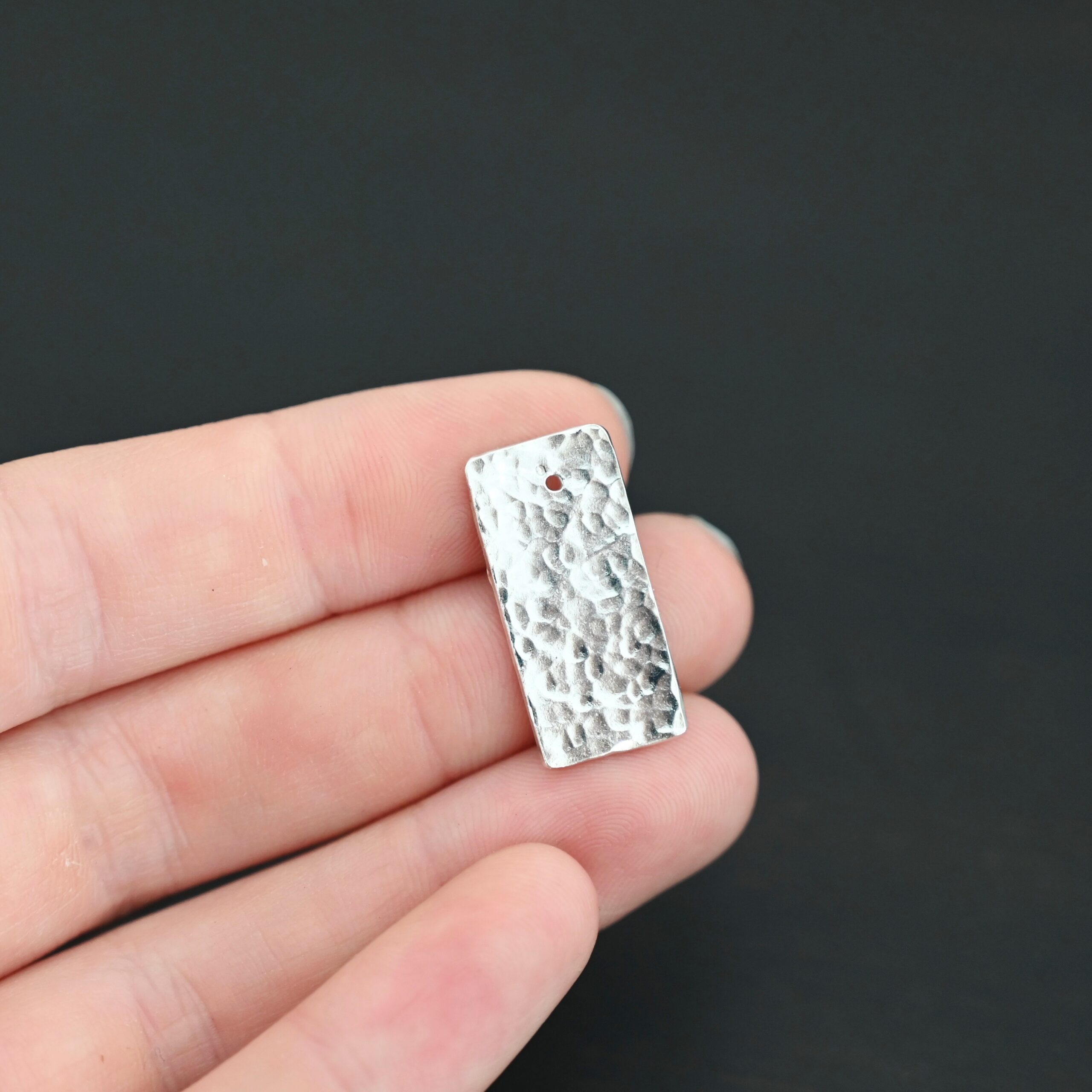 Sterling Silver Hammered Rectangle Blank - shiny shown in hand