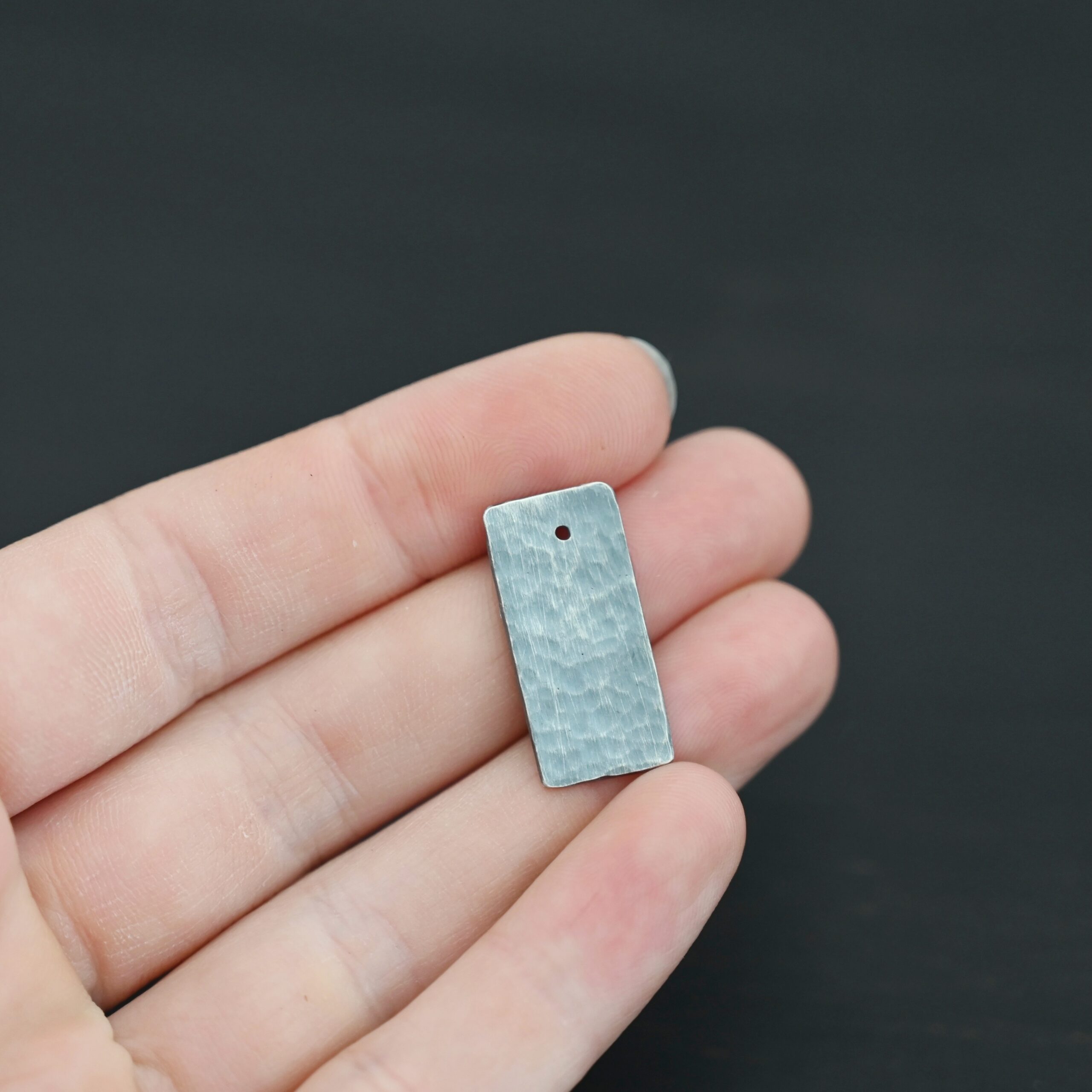 Sterling Silver Hammered Rectangle Blank - oxidized shown in hand