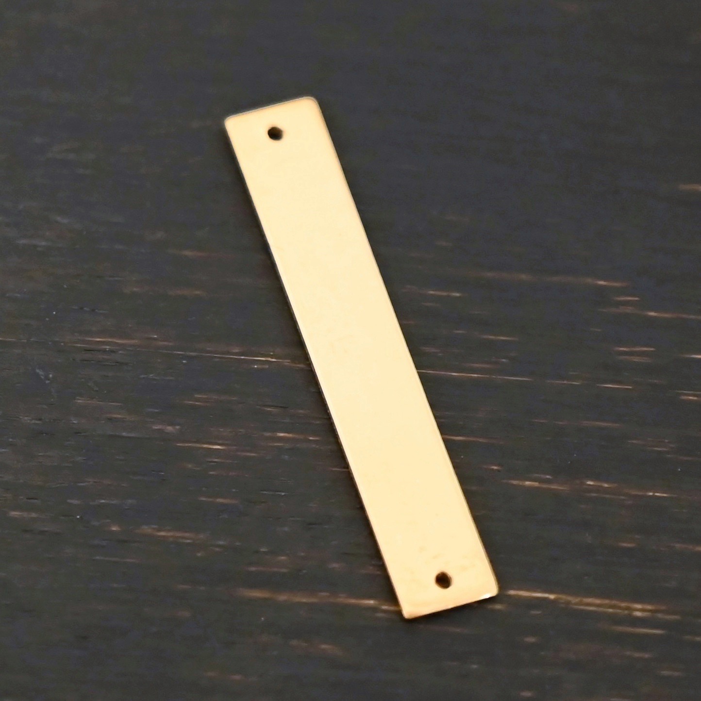 14k gold filled large rectangle blank - smooth 2 holes shown on dark background