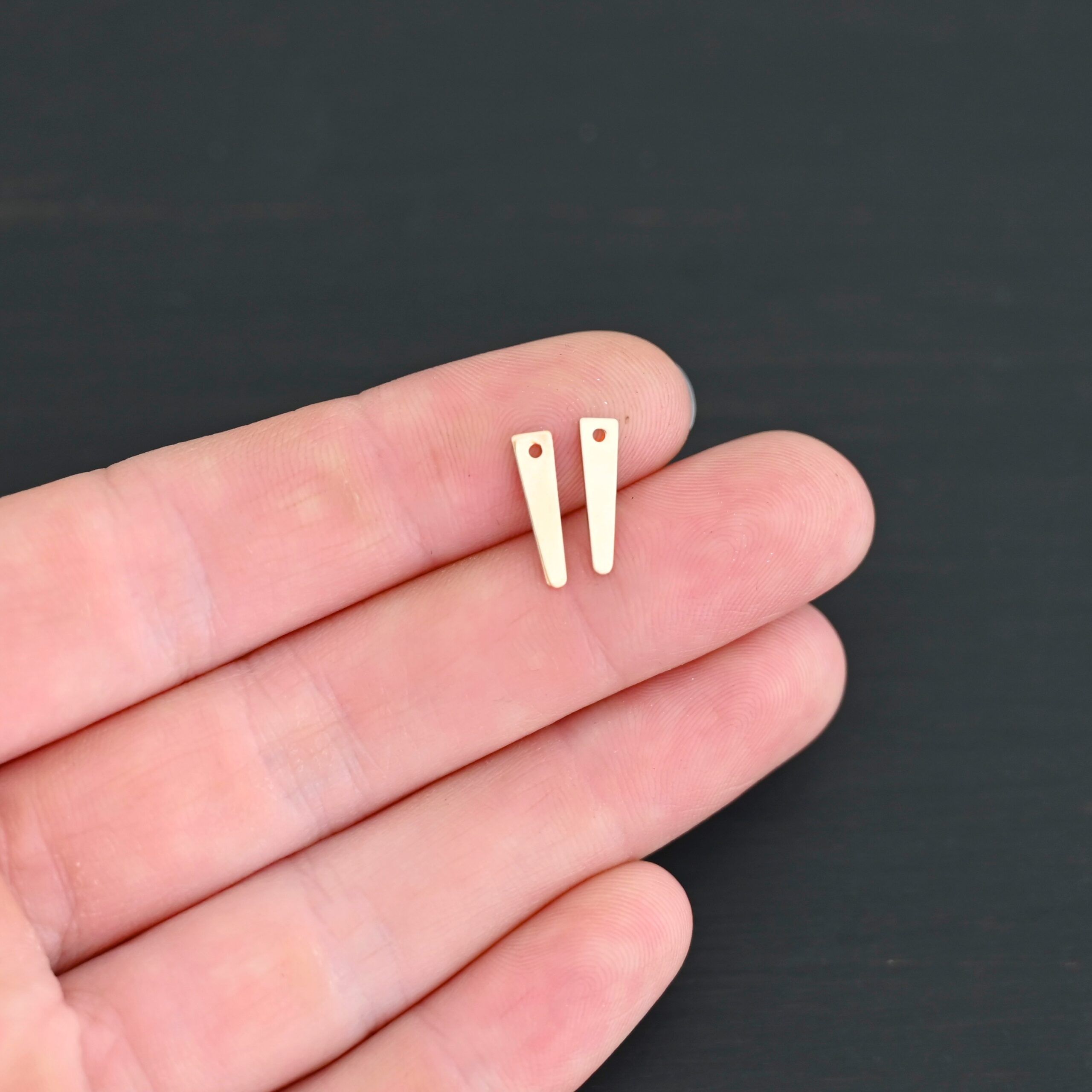 14k Gold Filled triangle blank - small smooth shown on dark background