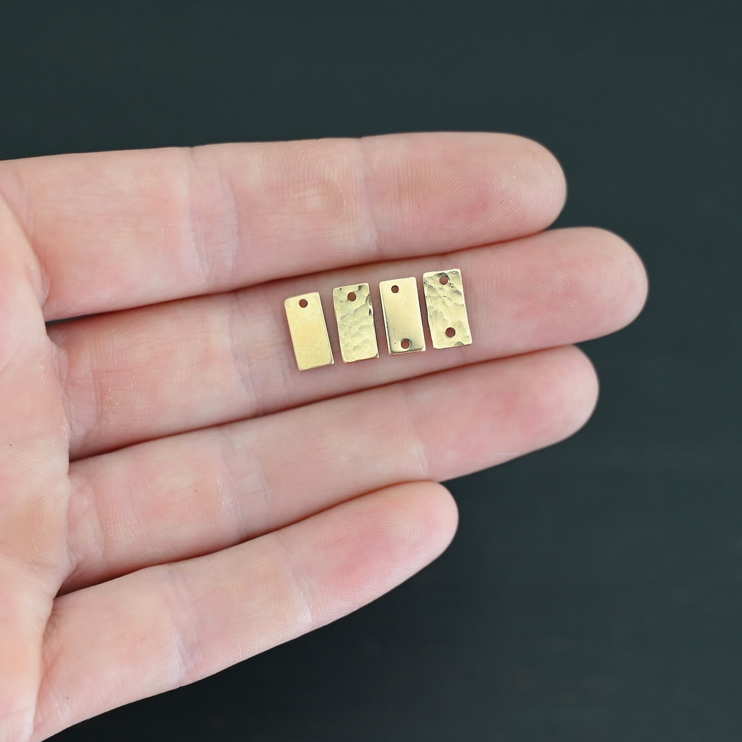 14k gold filled small rectangle blanks shown in hand