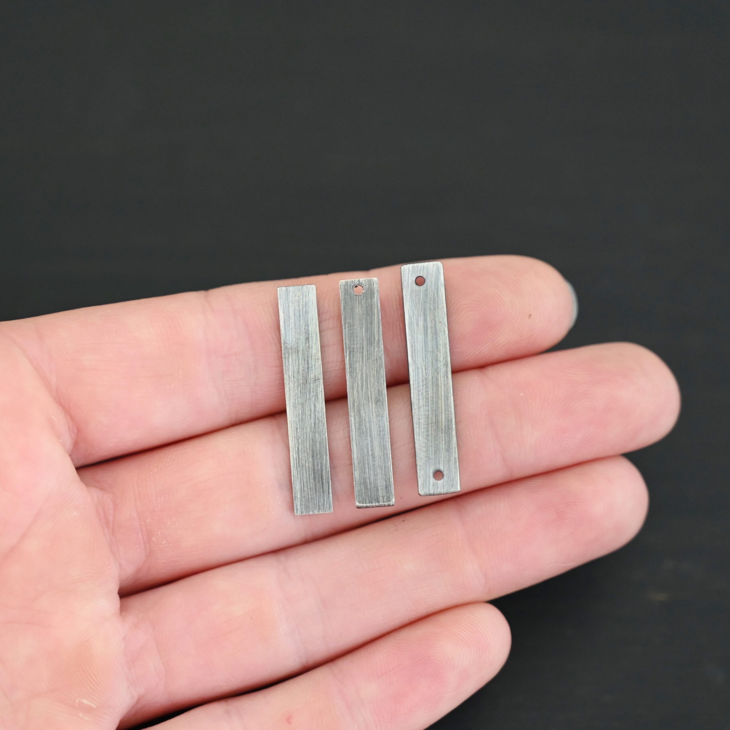 Sterling Silver large rectangle blanks - oxidized smooth shown in hand