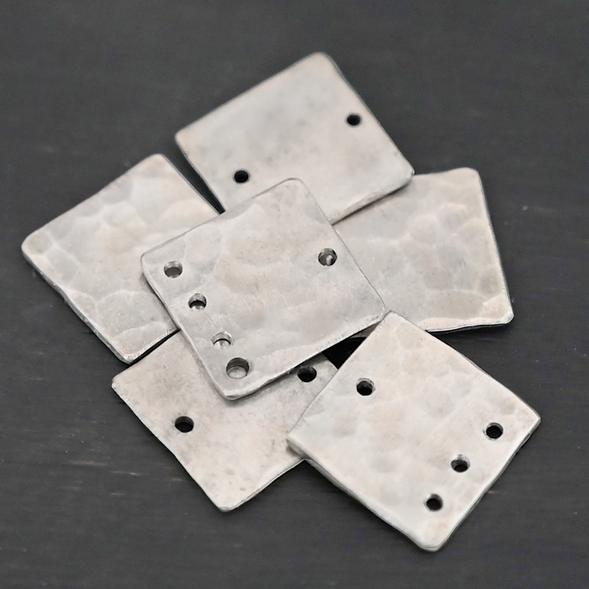 Hammered Square - shiny Hammered Square - shiny shown in dark background