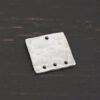Hammered Square - shiny 4 holes shown in dark background
