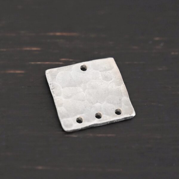 Hammered Square - shiny 4 holes shown in dark background