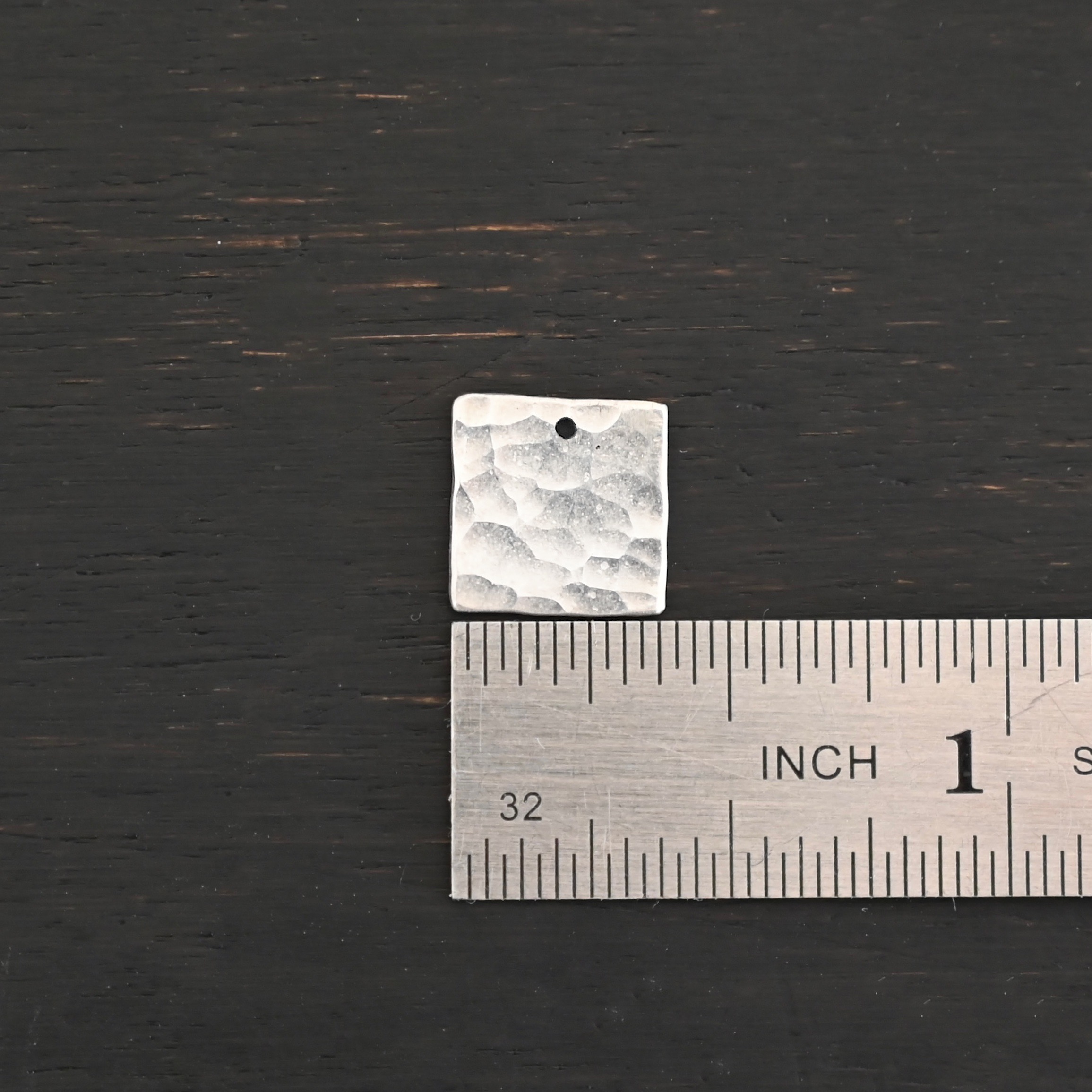Hammered Square - shiny 1 hole Hammered Square - shiny 1 hole shown by ruler