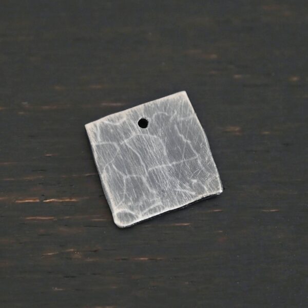 Hammered Square - oxidized 1 hole shown on dark background