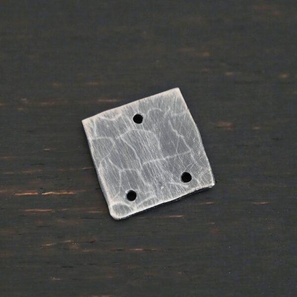 Hammered Square - oxidized 3 holes shown on dark background