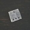 Hammered Square - oxidized 4 holes shown on dark background
