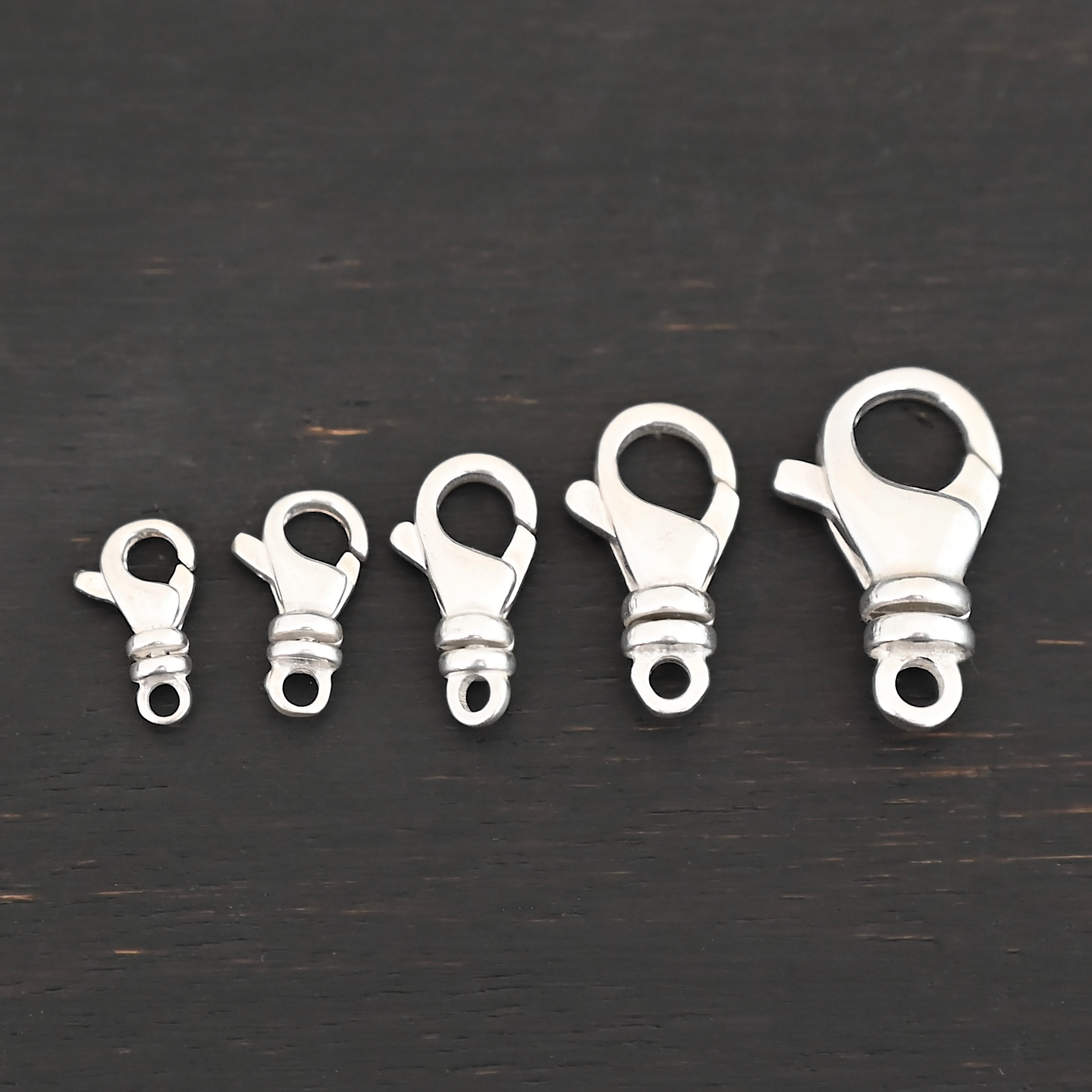 Sammy Swivel Lobster claw clasp - shiny shown on dark background