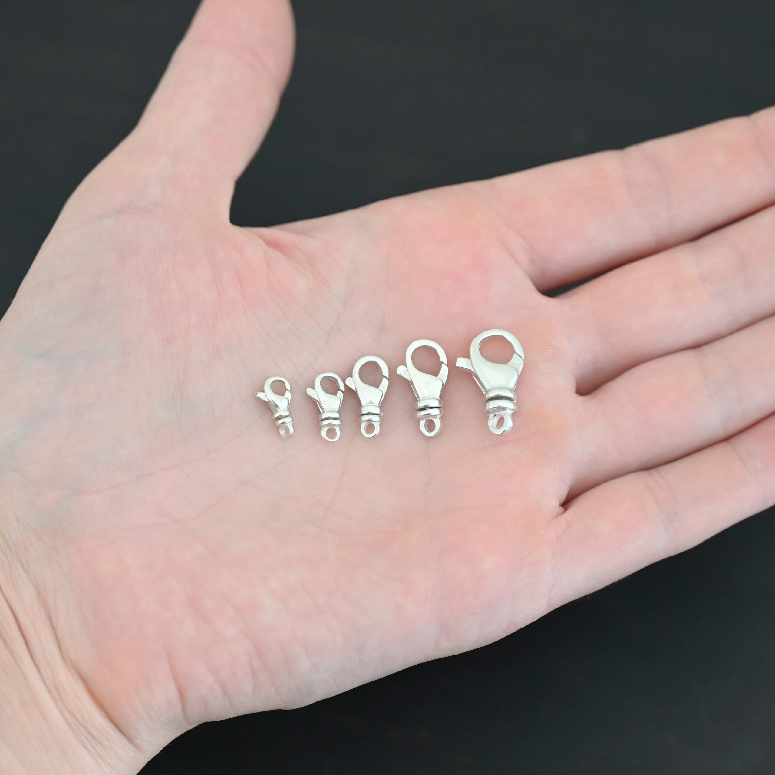 Sammy Swivel Lobster claw clasp - shiny shown in hand