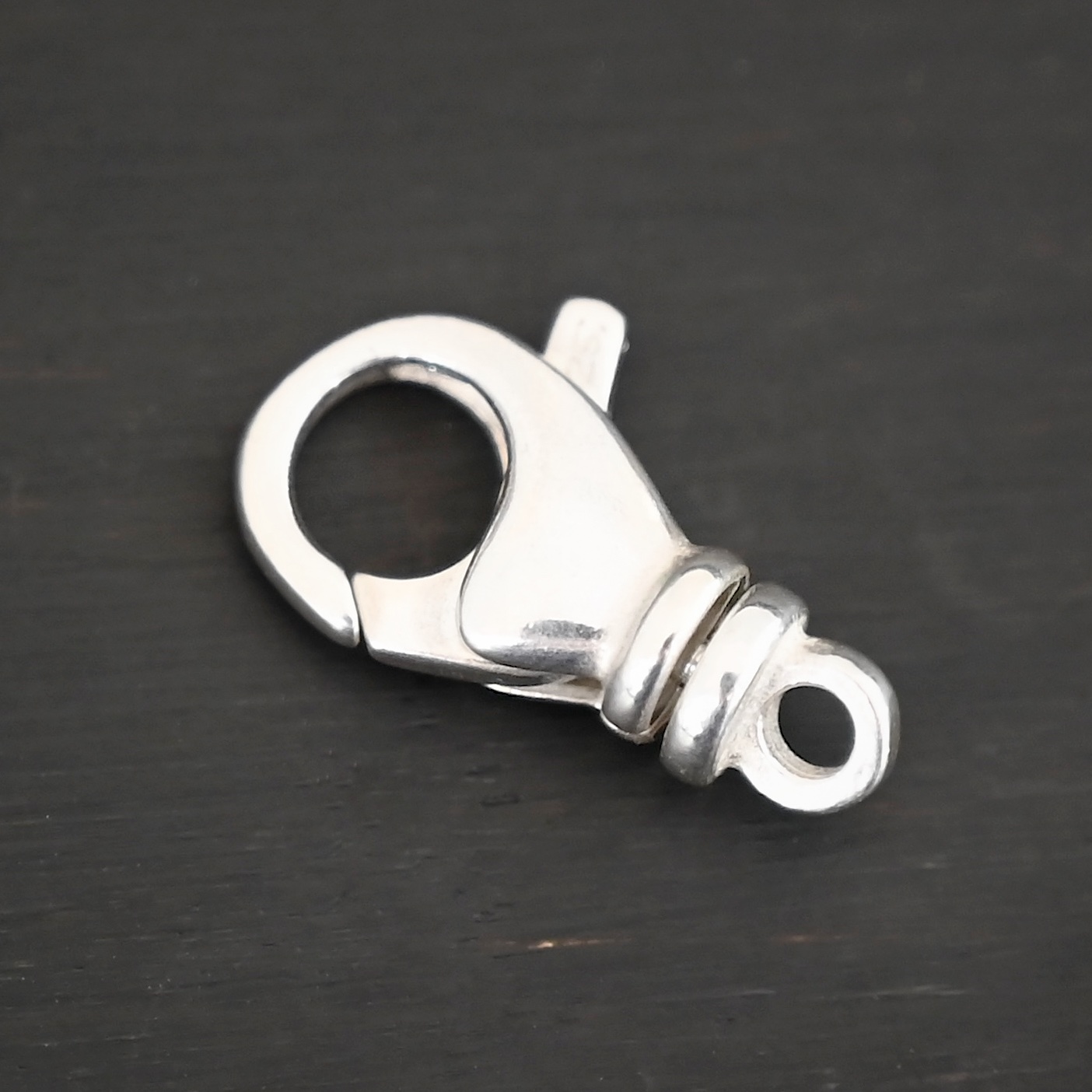 Sammy Swivel Lobster claw clasp - shiny shown on dark background