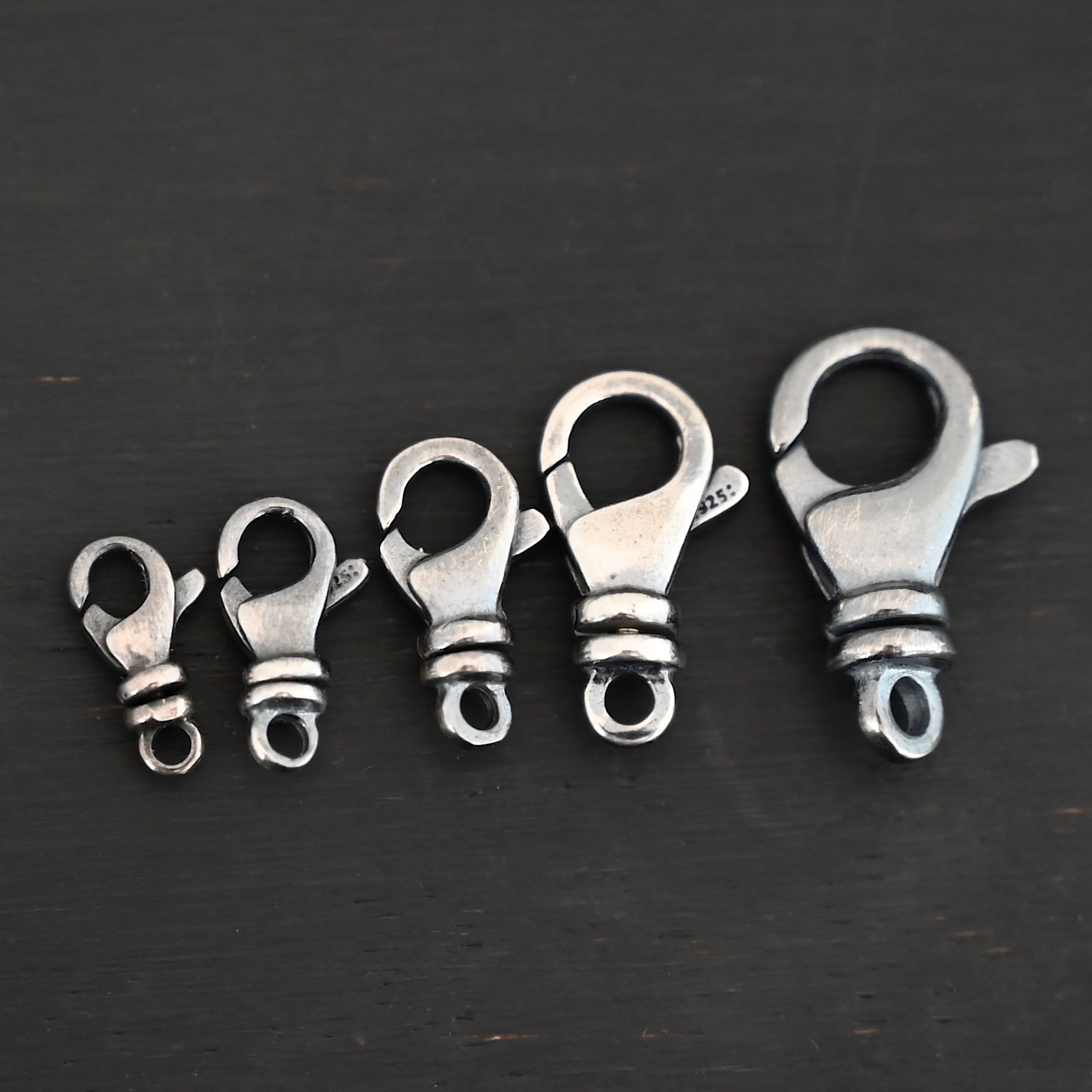 Sammy Swivel Lobster claw clasp - oxidized shown on dark background