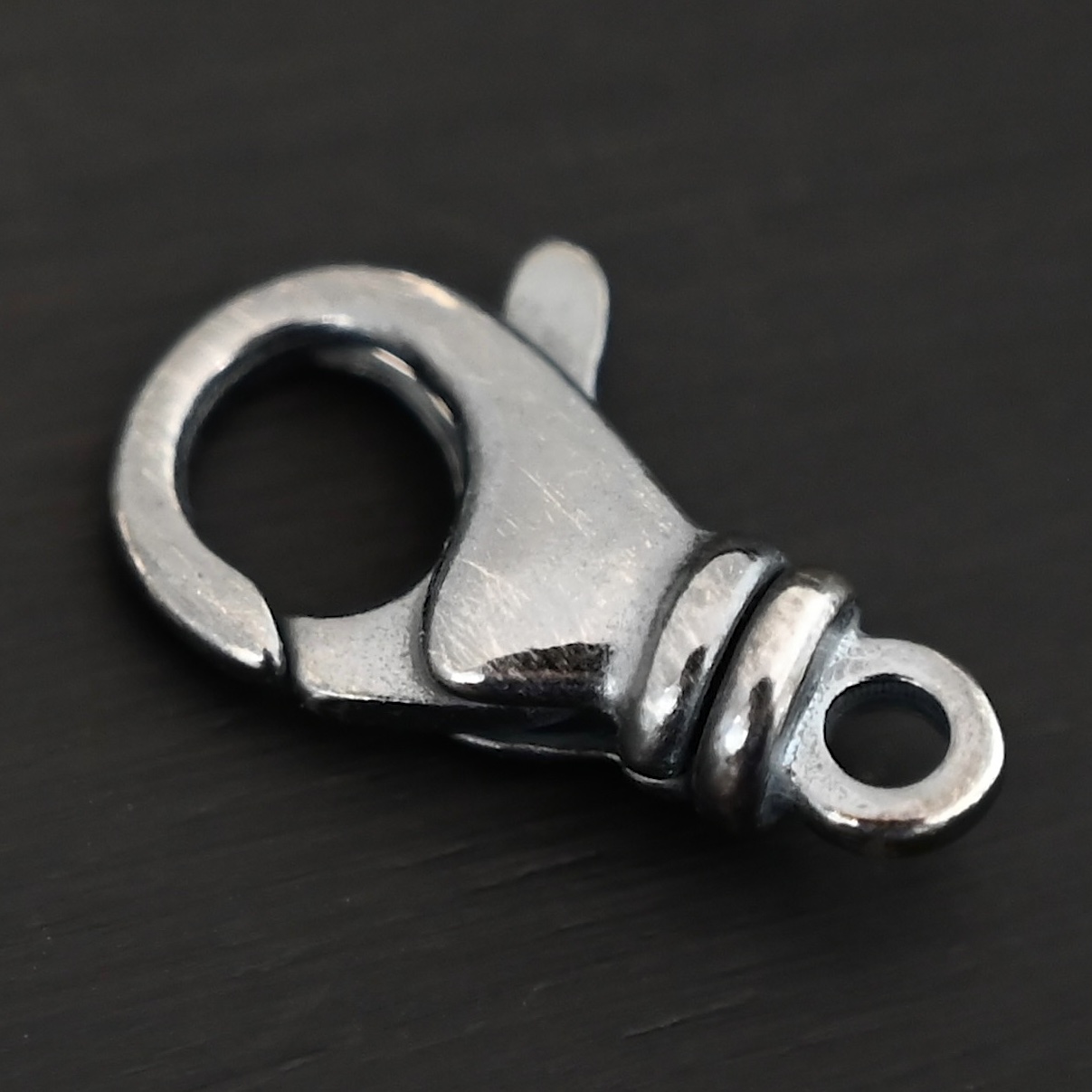 Sammy Swivel Lobster claw clasp - oxidized shown on dark background