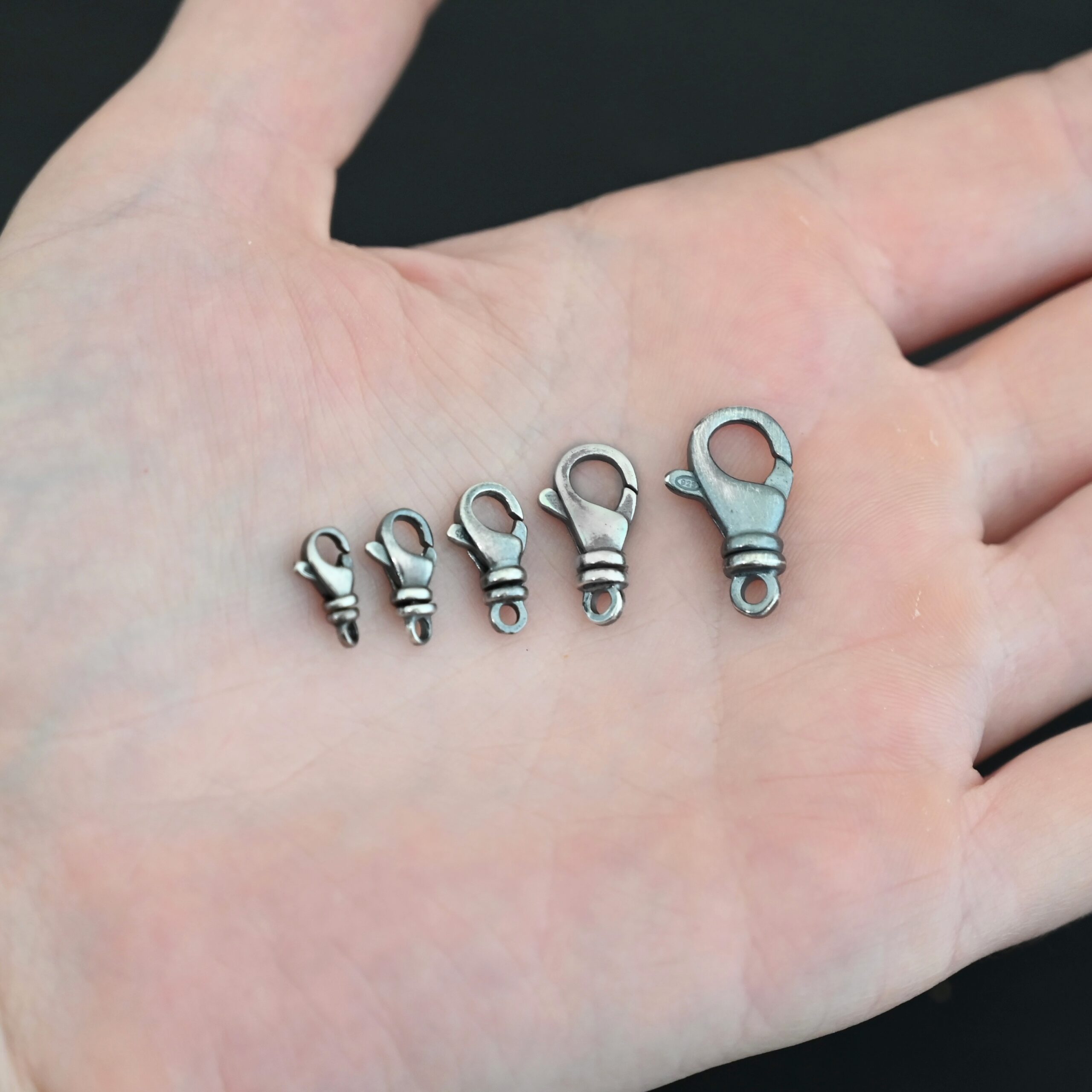 Sammy Swivel Lobster claw clasp - oxidized shown in hand