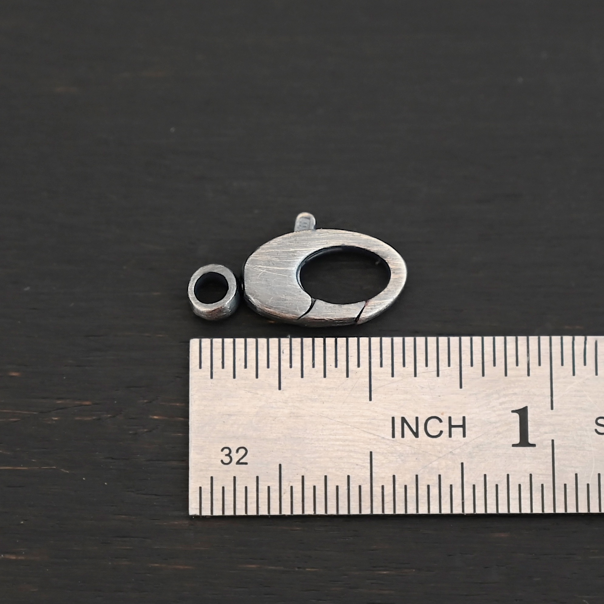 Sunny Swivel Lobster Claw clasp - oxidized Sunny Swivel Lobster Claw clasp - oxidized shown by ruler