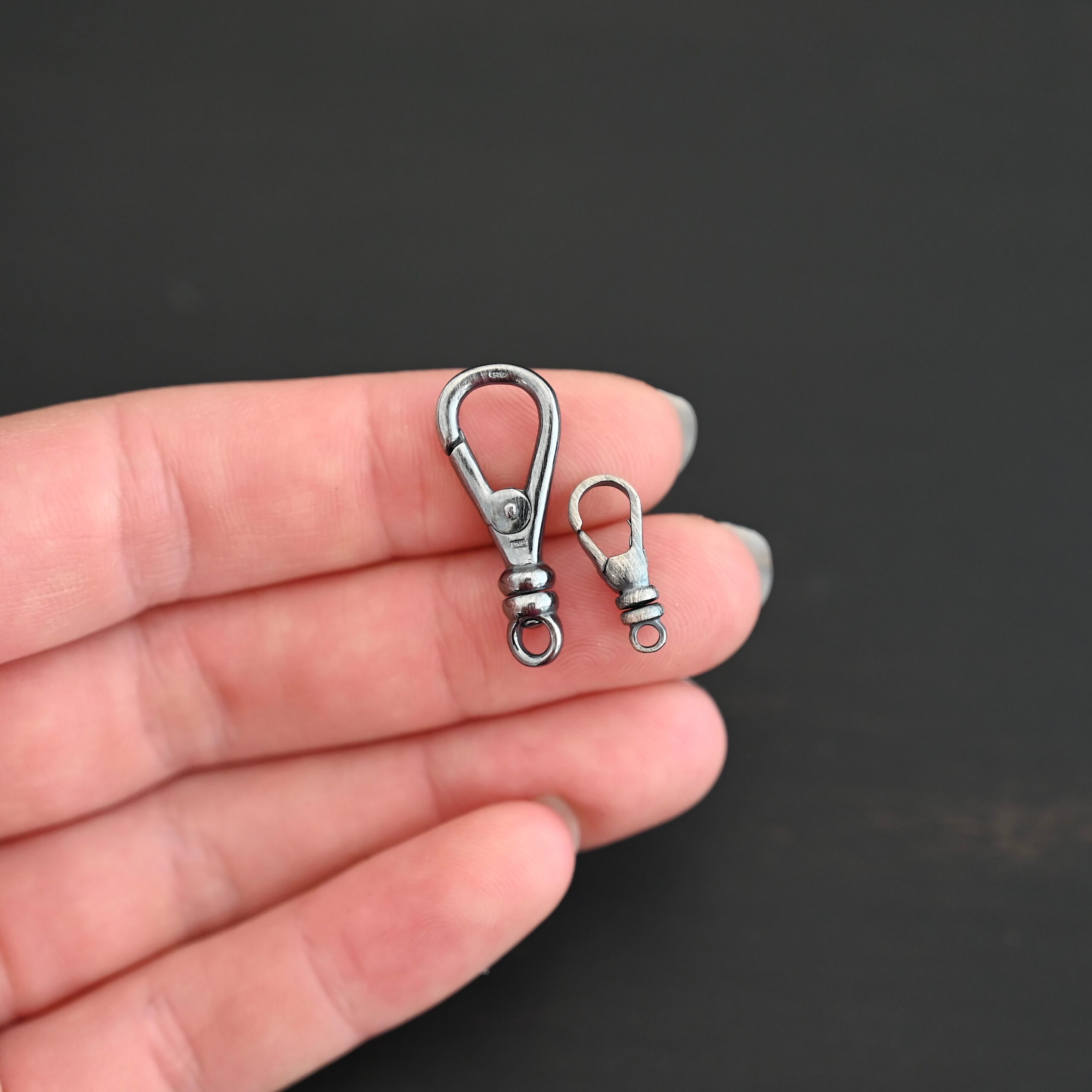 Sage Swivel Lobster Claw Clasp - oxidized shown in hand