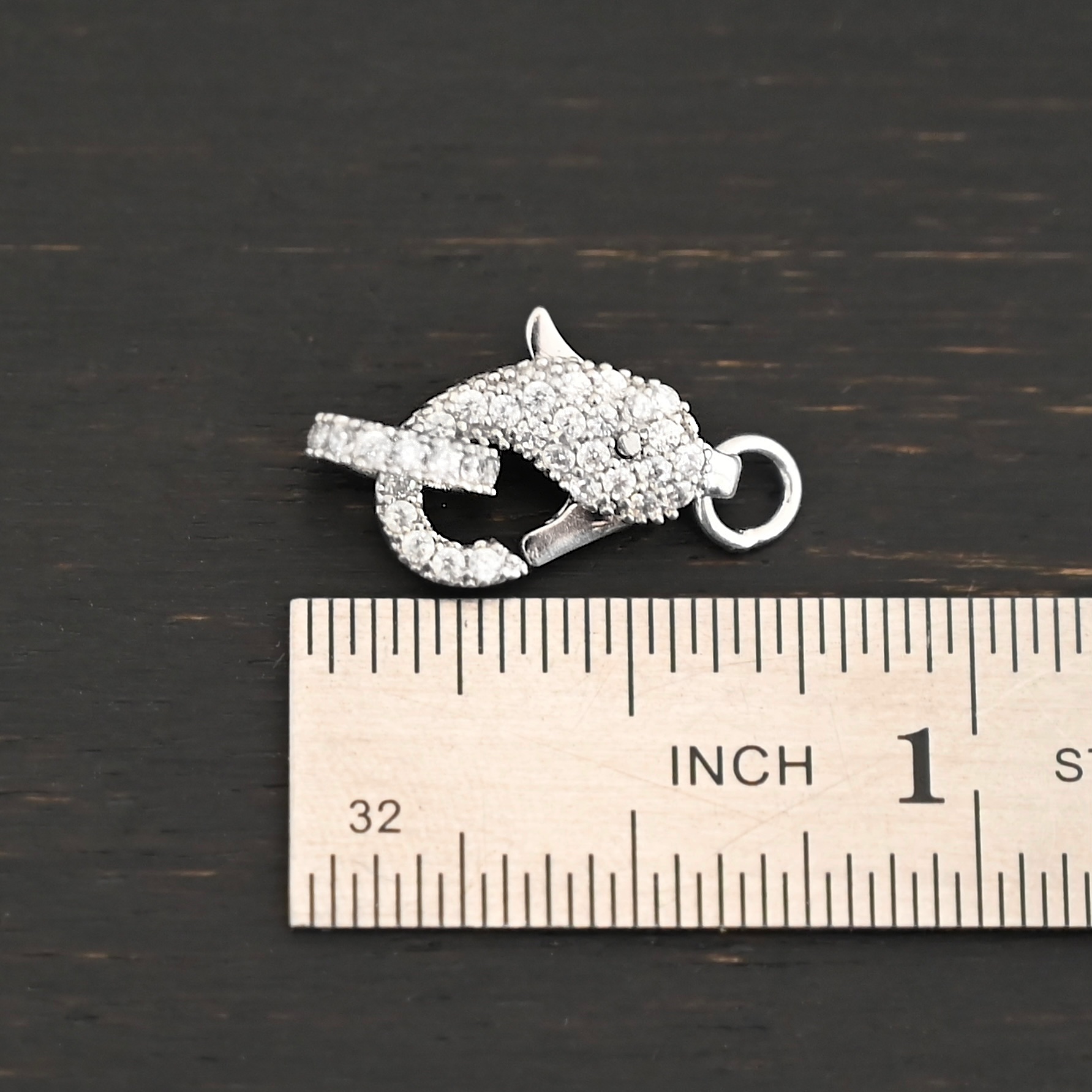 Caroline CZ Lobster Claw shown by ruler