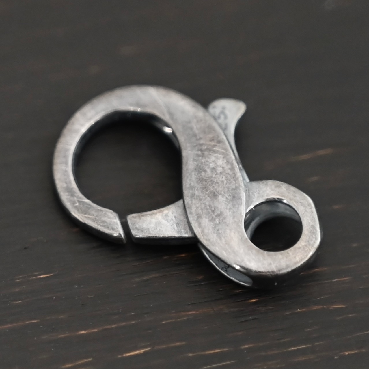 Faith Figure 8 Lobster Claw - oxidized Faith Figure 8 Lobster Claw - oxidized shown on dark background