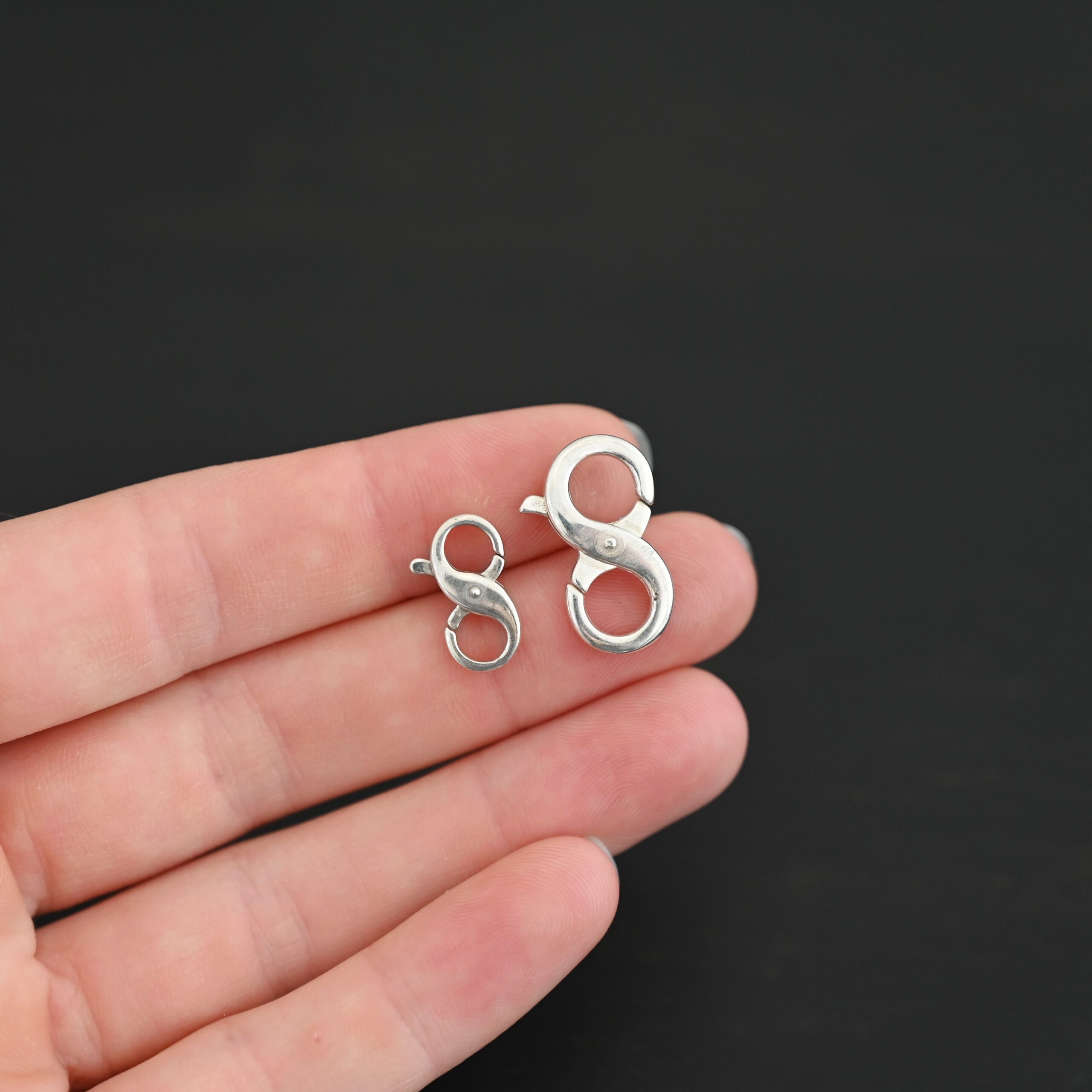 Daisy double lobster claw - shiny shown in hand