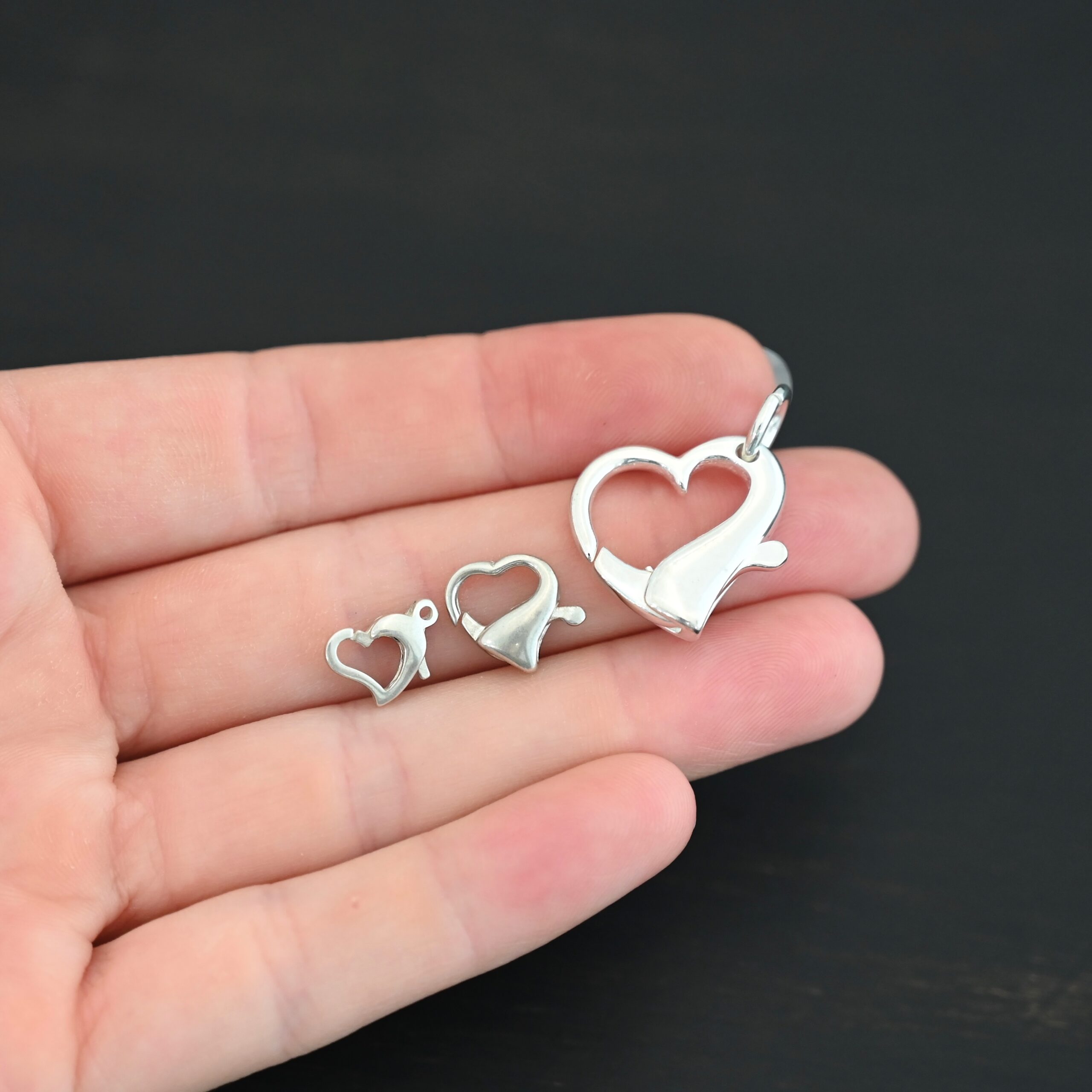 Hallie Heart Lobster Claw - shiny shown in hand