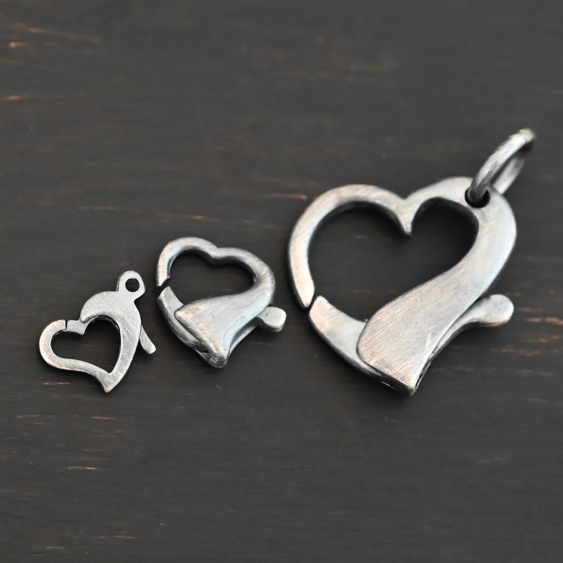 Hallie Heart Lobster Claw - oxidized shown on dark background