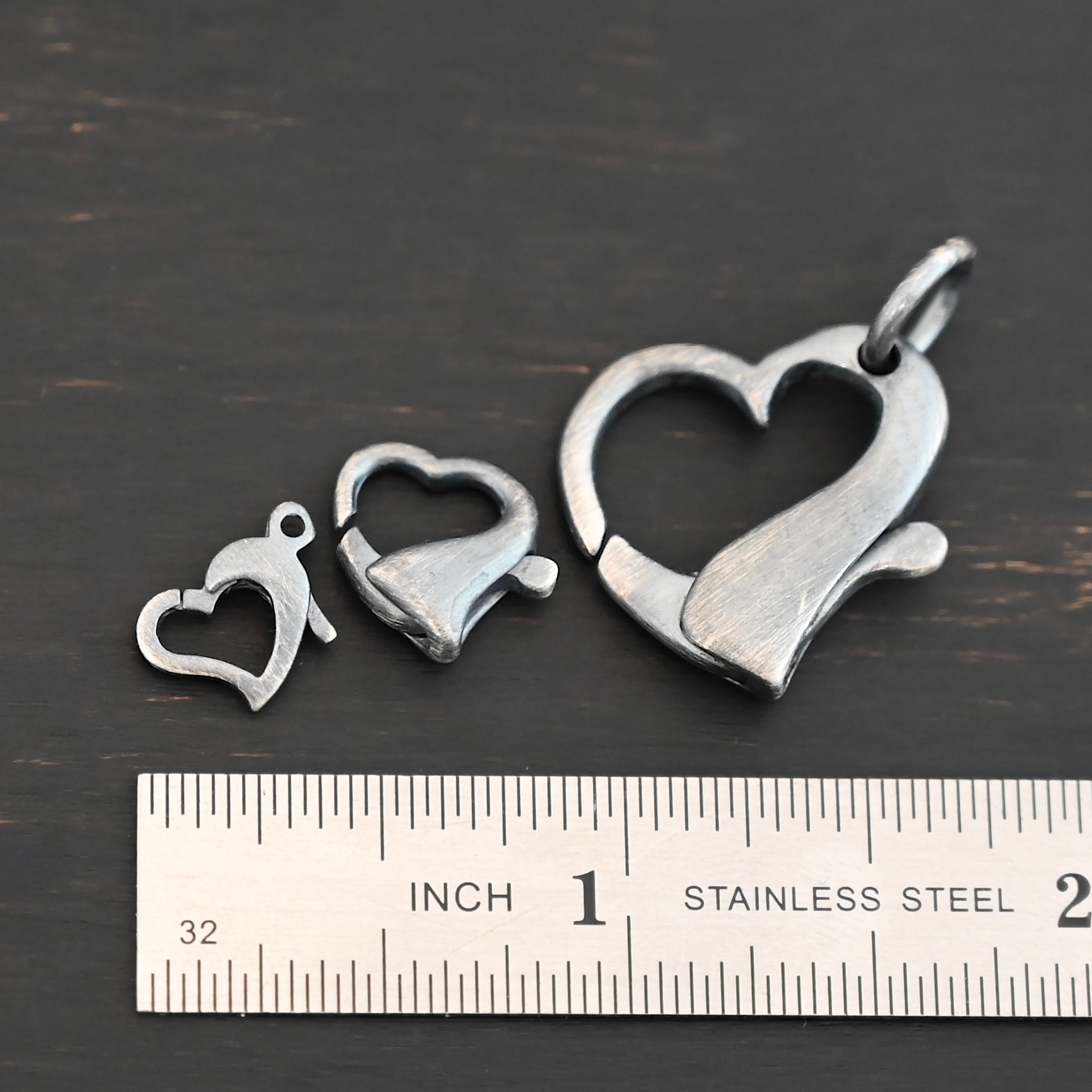 Hallie Heart Lobster Claw - oxidized shown by ruler