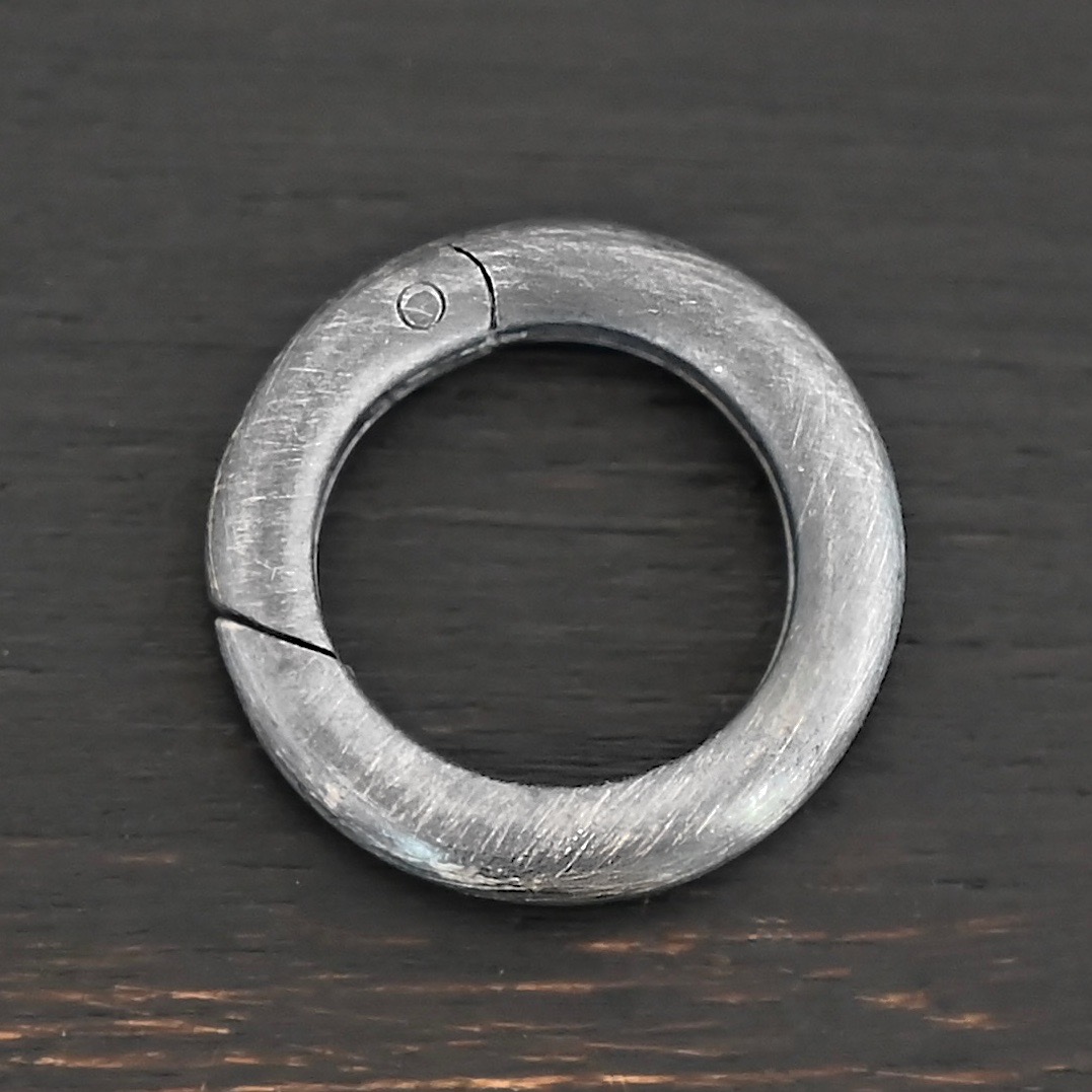 Penny Push Clasp - oxidized shown on dark background
