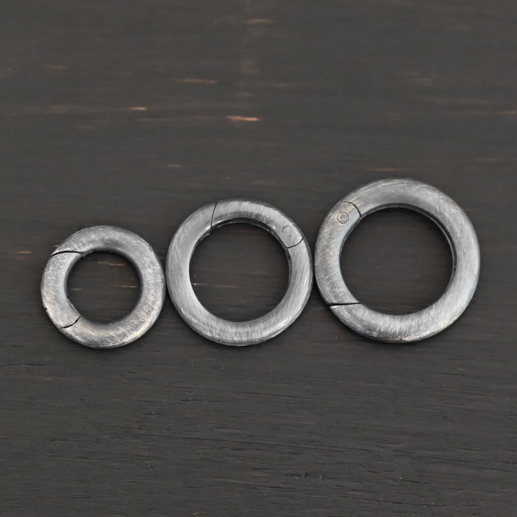 Piper Push Clasp - oxidized shown on dark background