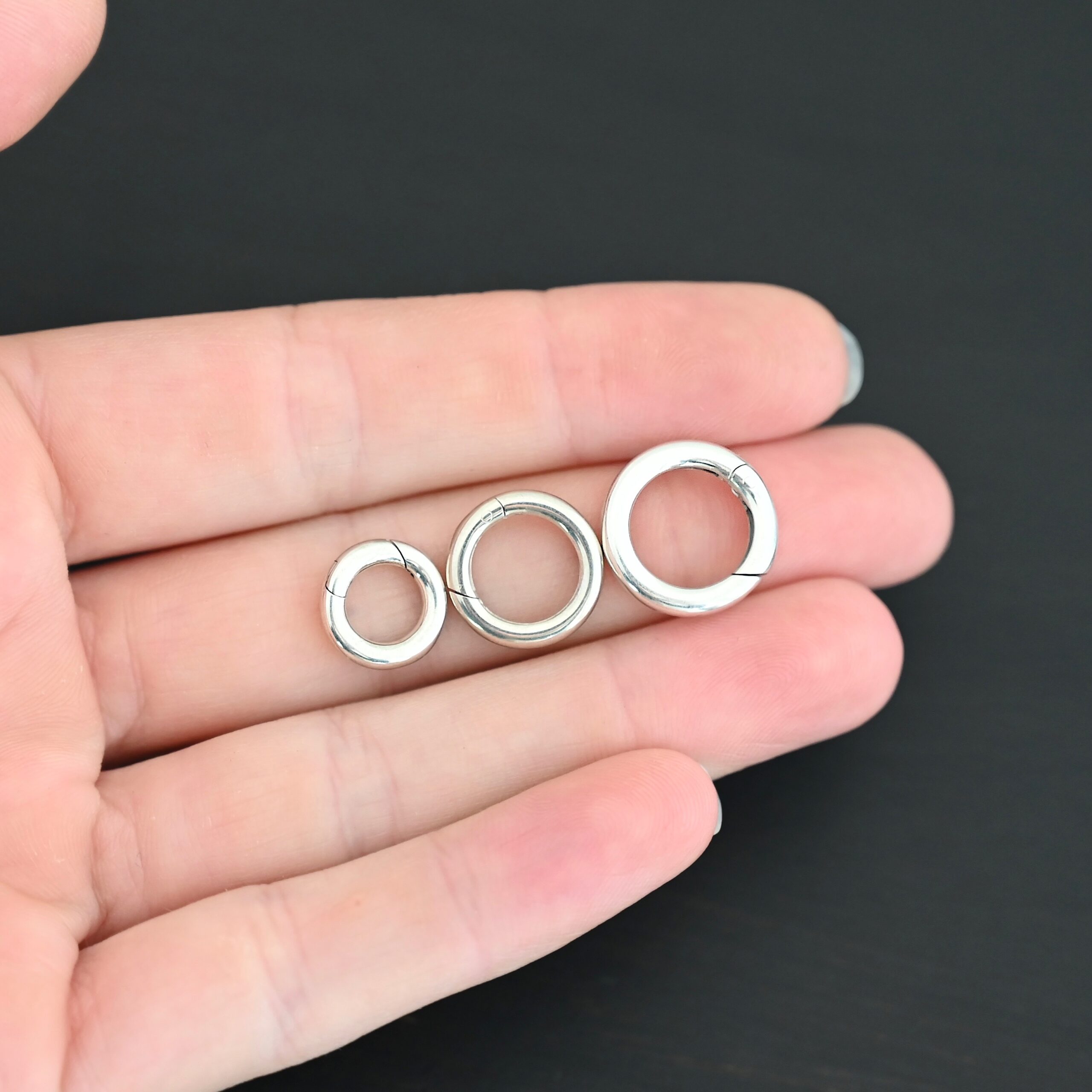 Piper Push Clasp - shiny shown in hand