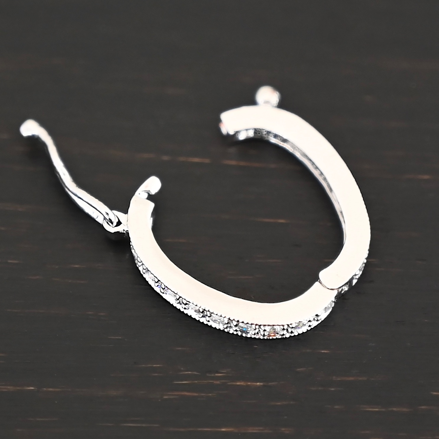 Ellie CZ Enhancer clasp shown on dark background