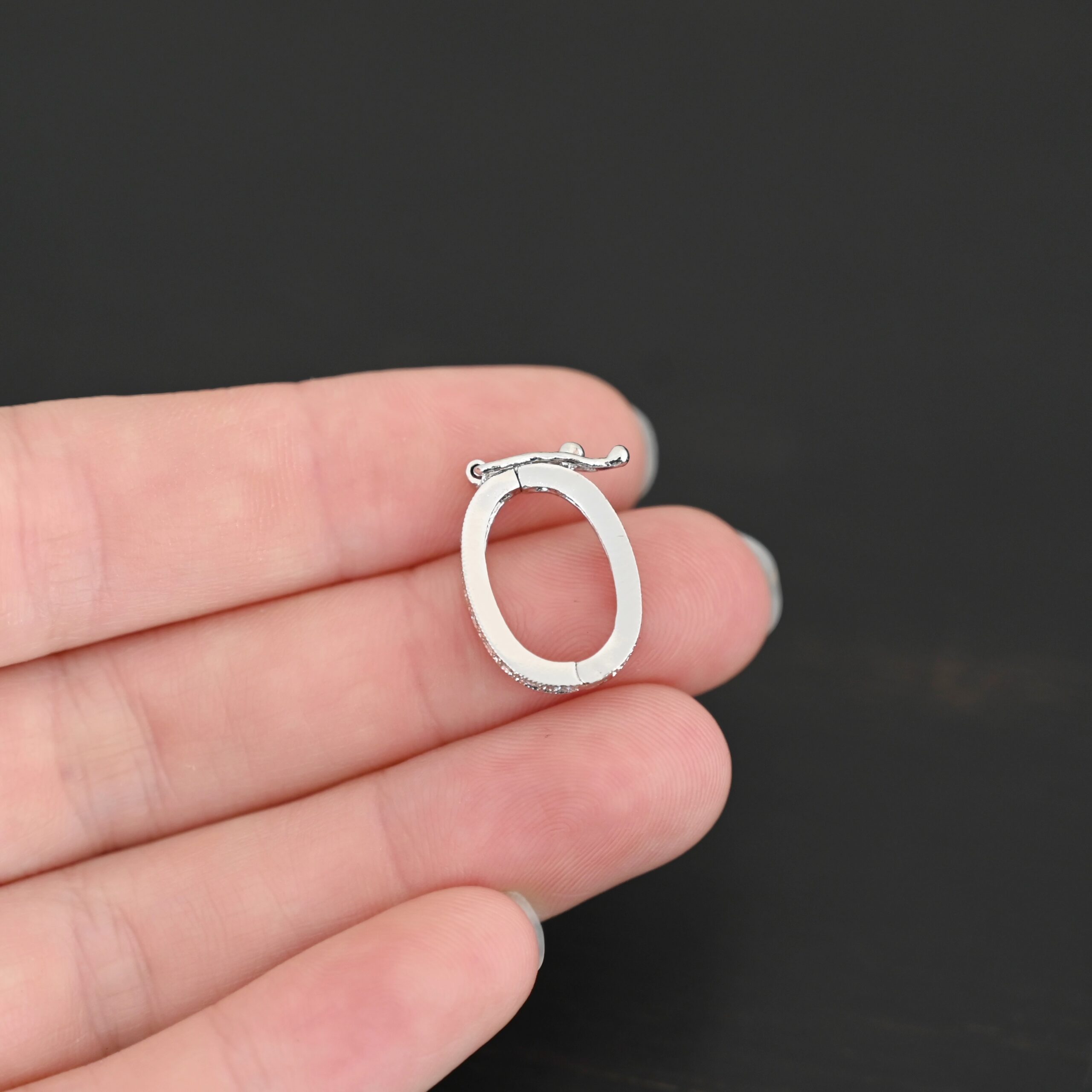 Ellie CZ Enhancer clasp shown in hand