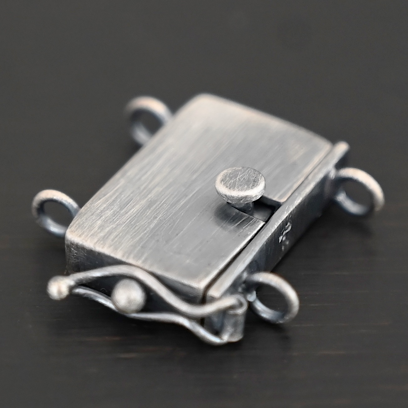 Box Clasp - oxidized shown on dark background