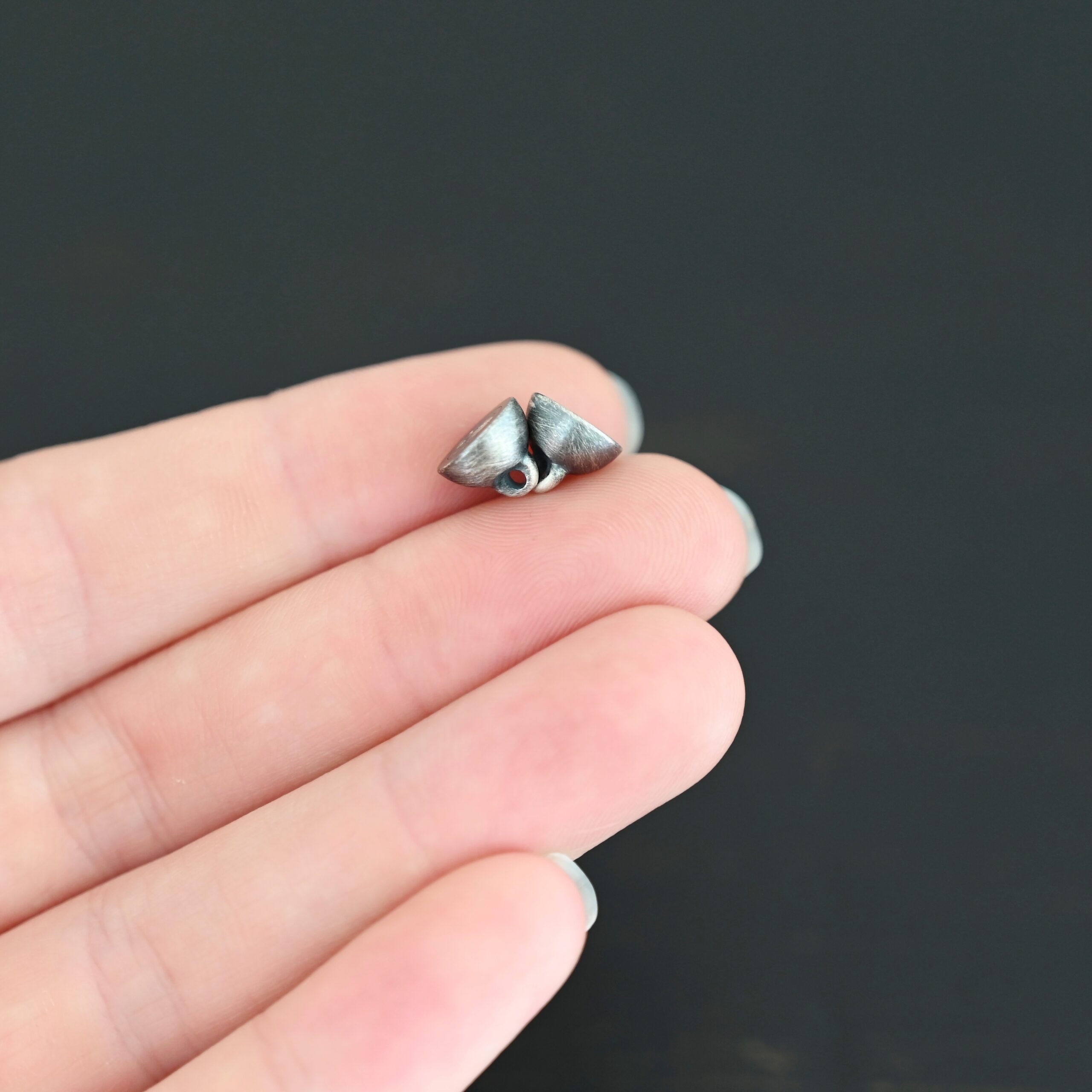 Melody Round Magnetic Clasp - oxidized shown in hand