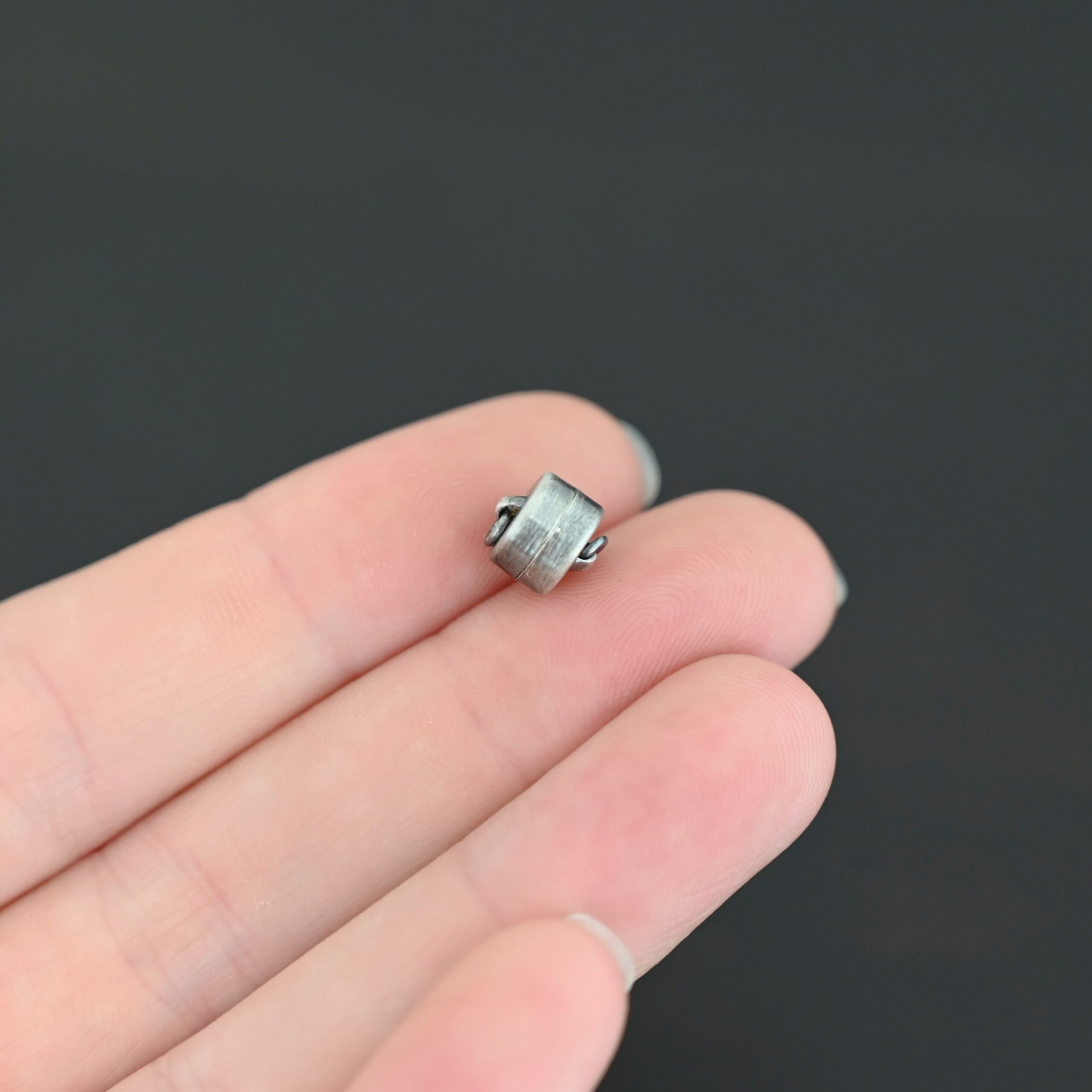 Melody Round Disc Magnetic Clasp - oxidized shown in hand