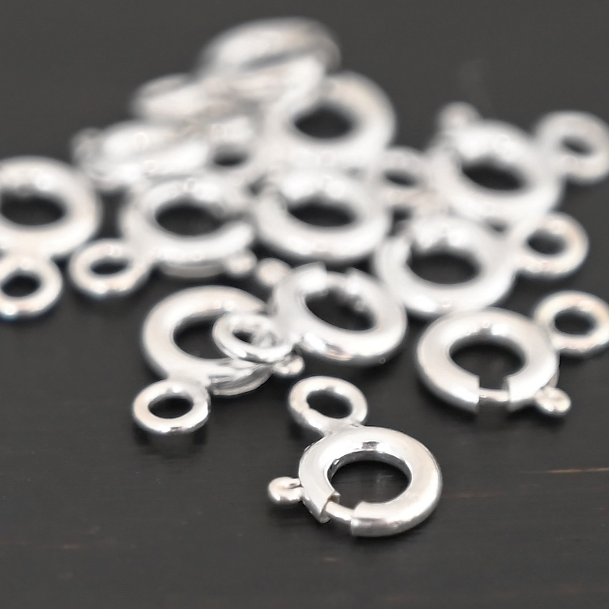 Sky Spring Ring Clasps - shiny shown on dark background