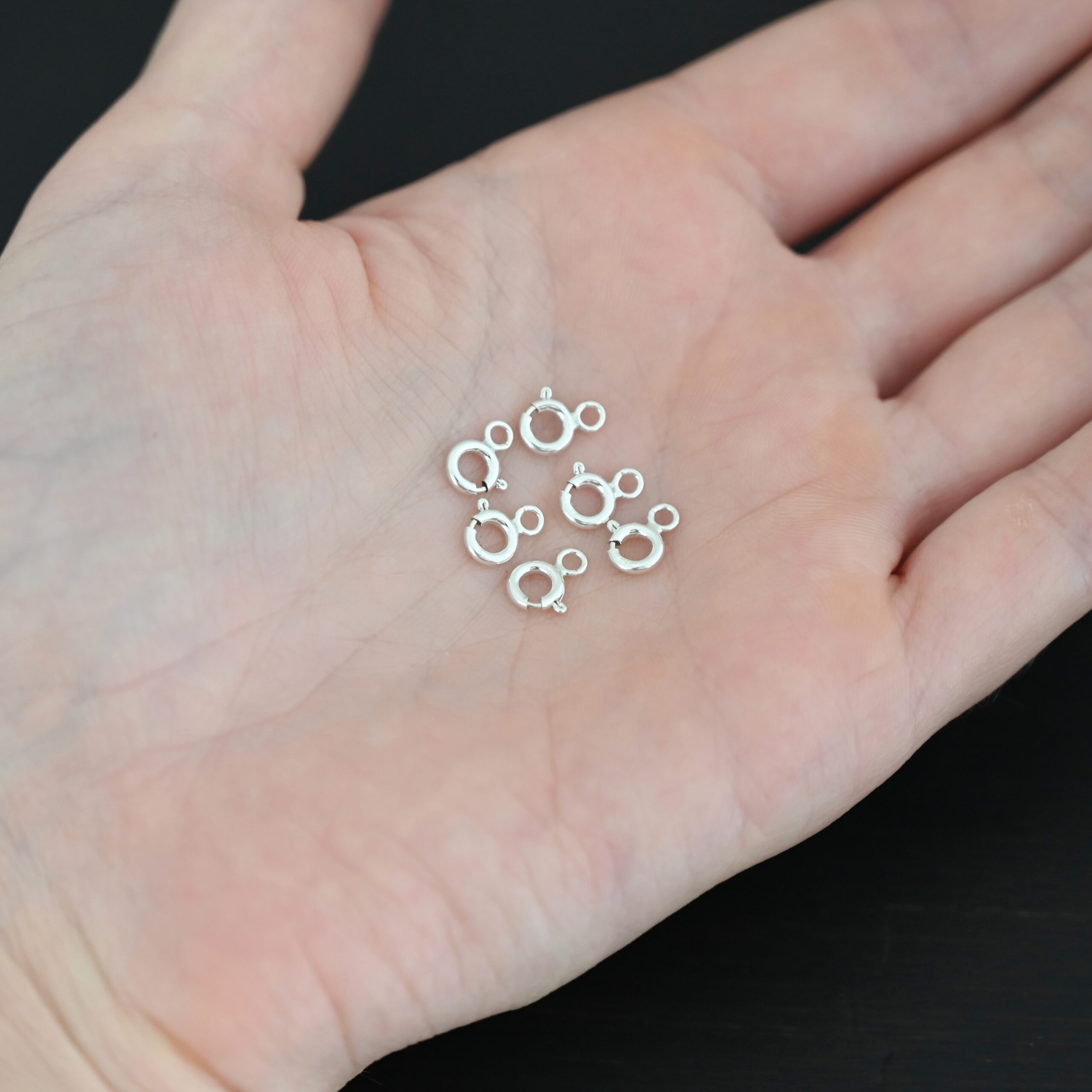 Sky Spring Ring Clasps - 6pcs shiny shown in hand
