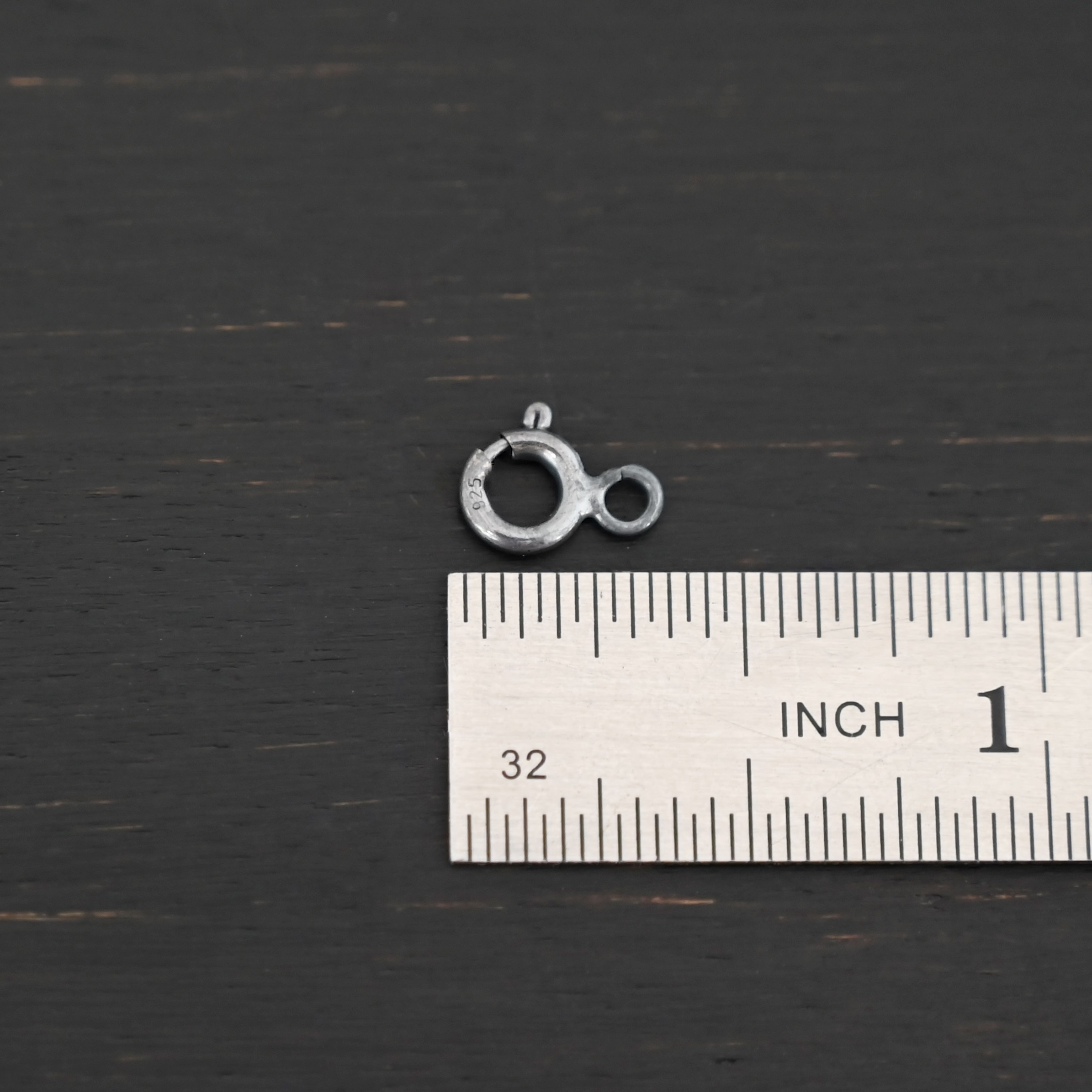Sky Spring Ring Clasps - oxidized shown by ruler