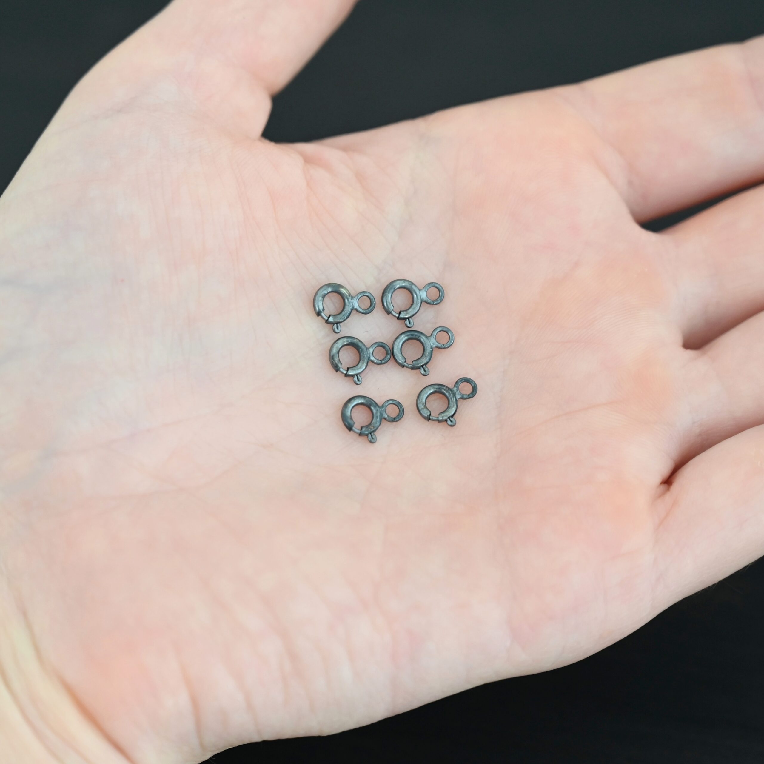 Sky Spring Ring Clasps - 6pcs oxidized shown in hand